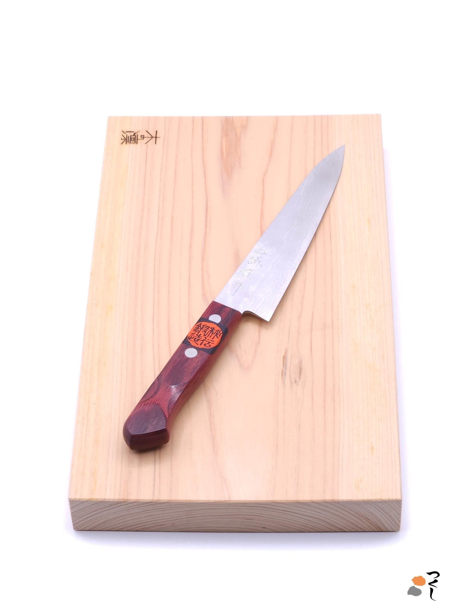 Top view of rectangular Japanese Chopping Board (Manaita) with a Japanese Petty Knife by Tanaka Shigeki made with VG 10 steel with red handle.