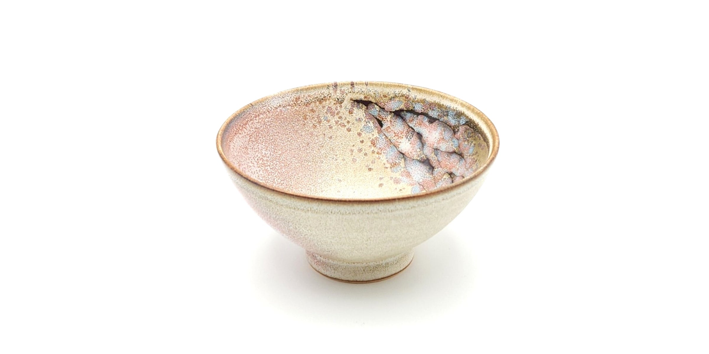 A pink rice Japanese bowl with a cherry blossom pattern against a white background. Tsukushi