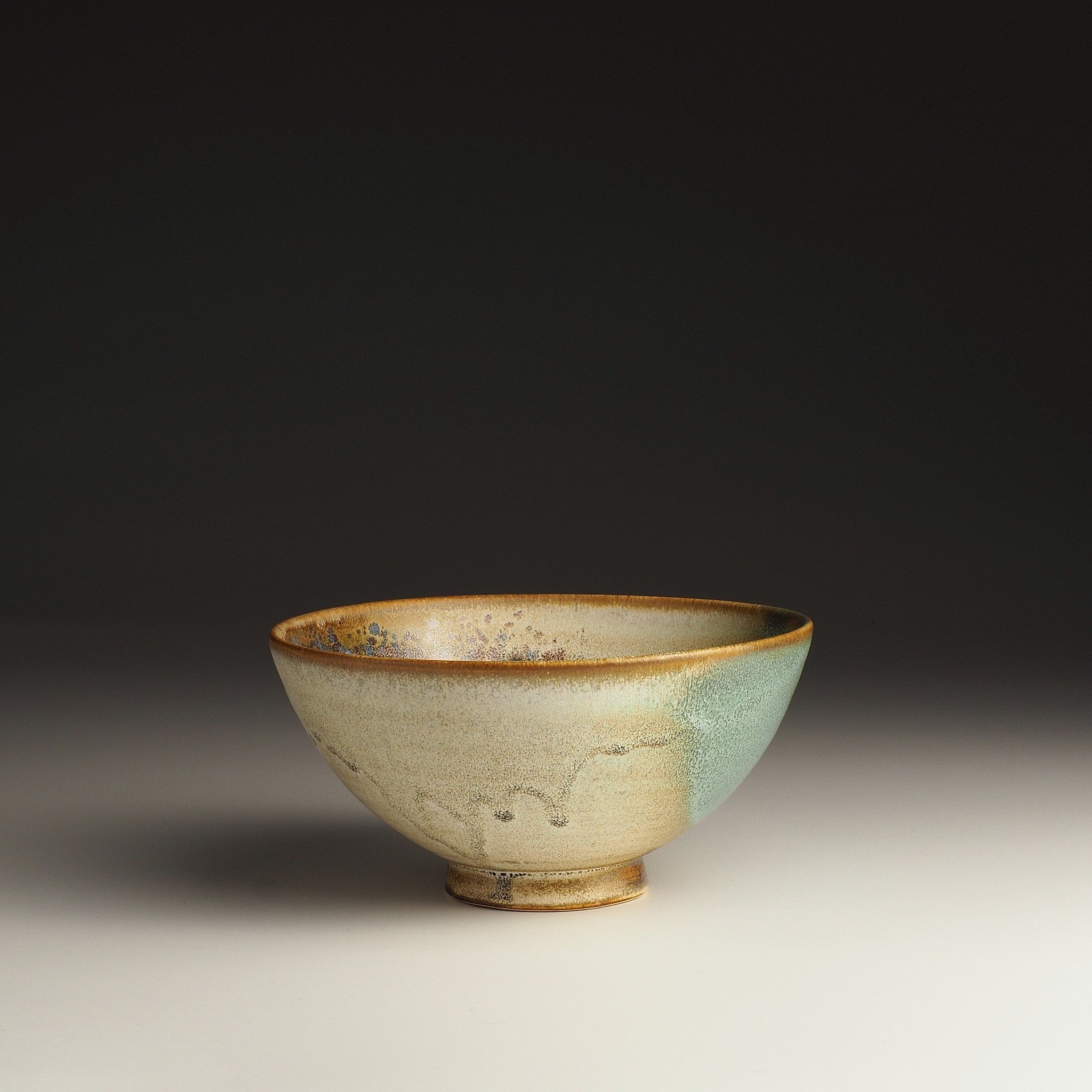 Handcraftd Japanese bowl with a gradient color on a dark background