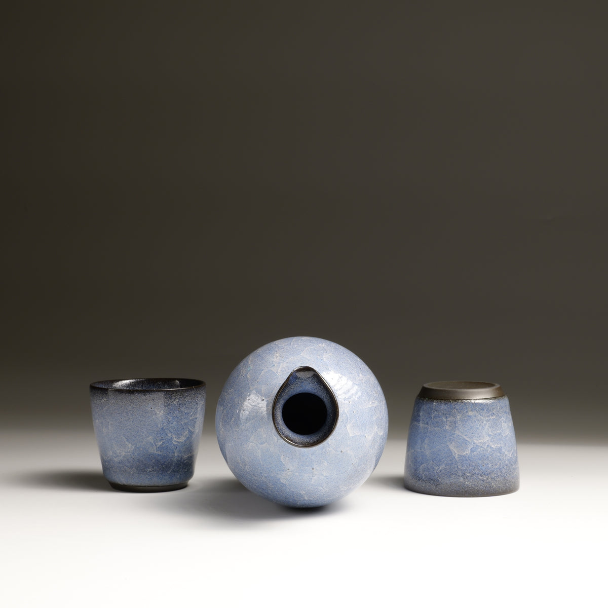 Top view of Seigen sake set with handmade tokkuri and two ochoko cups