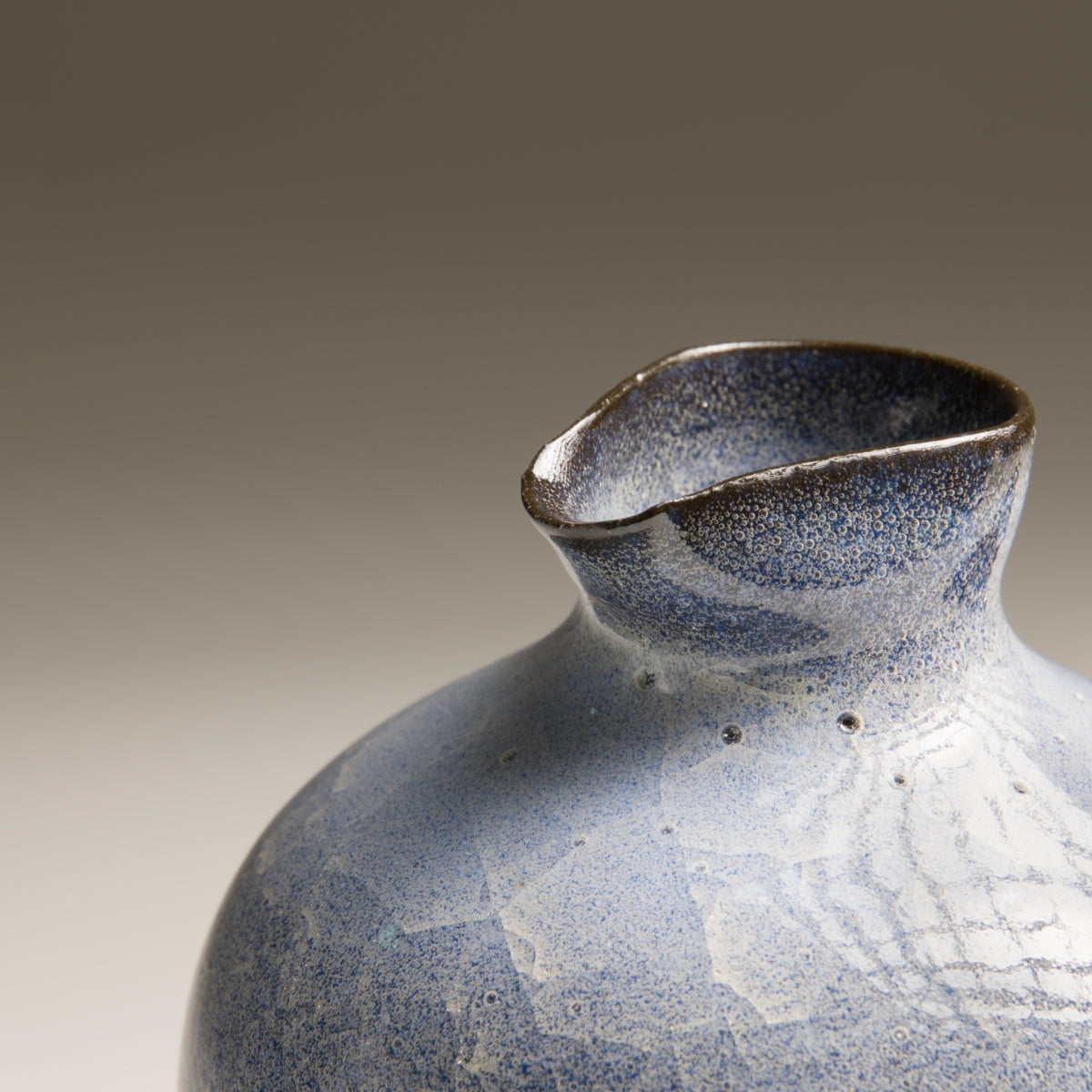Seigen ceramic tokkuri detail with handmade rim and blue crackle glaze