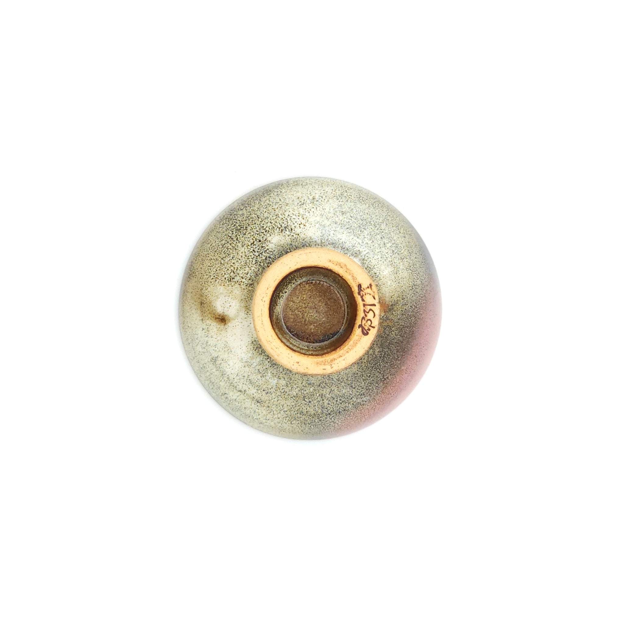 Bottom view of a flat Japanese ceramic sake cup. Tsukushi