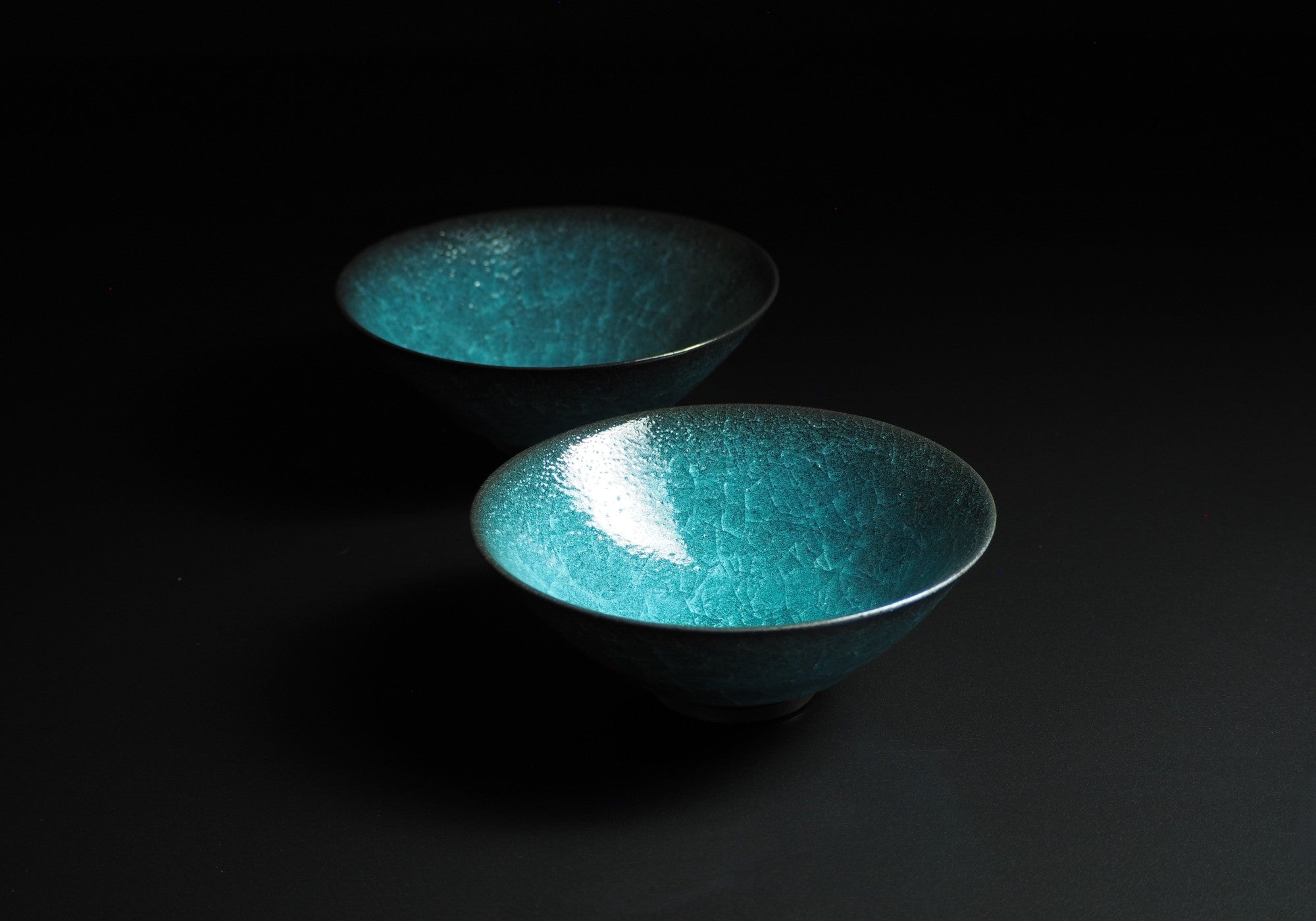 Handcrafted crazing Japanese ceramic Donburi bowl background black, Tsukushi