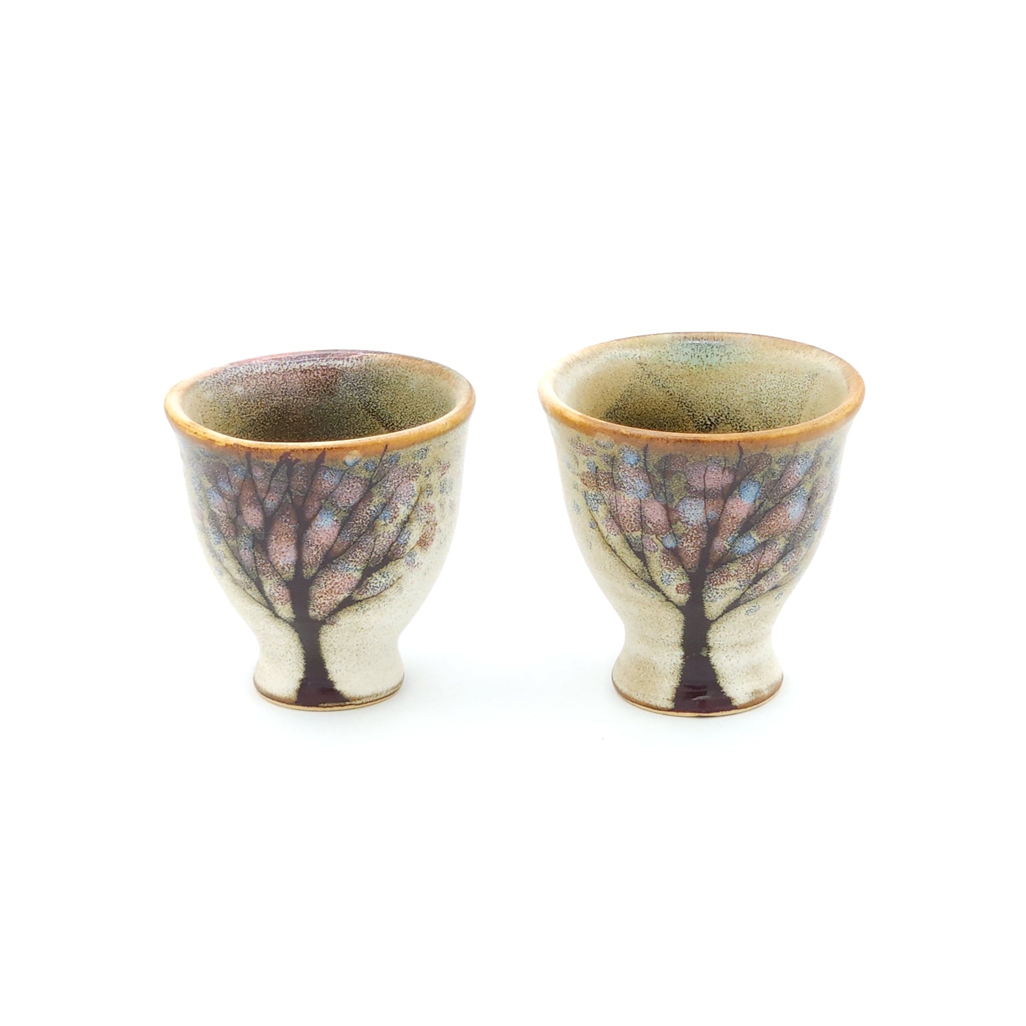 Set of two Japanese ceramic Conical Sake cups with a cherry blossom pattern. Tsukushi