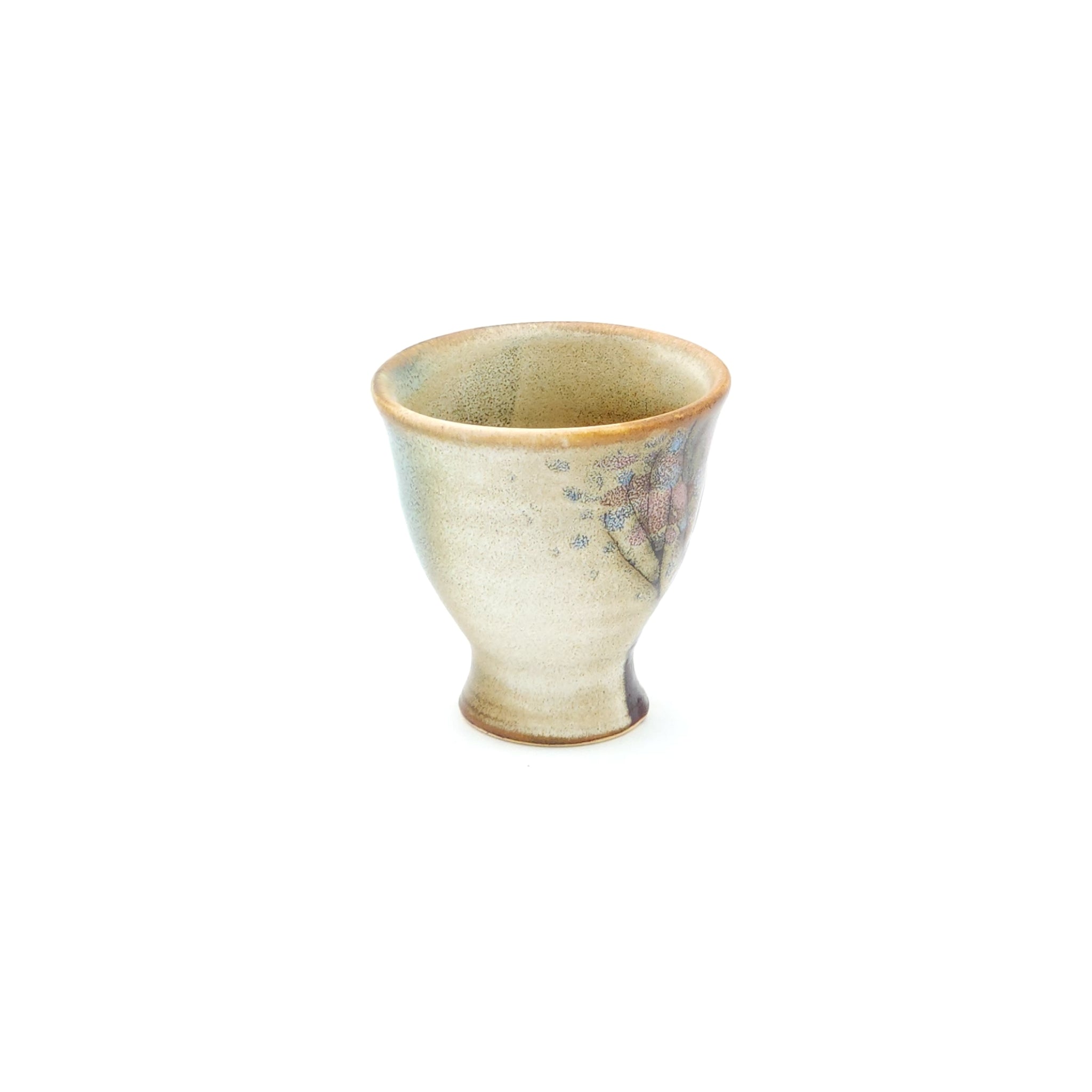 A Japanese ceramic Conical Sake cup with a cherry blossom pattern. Tsukushi