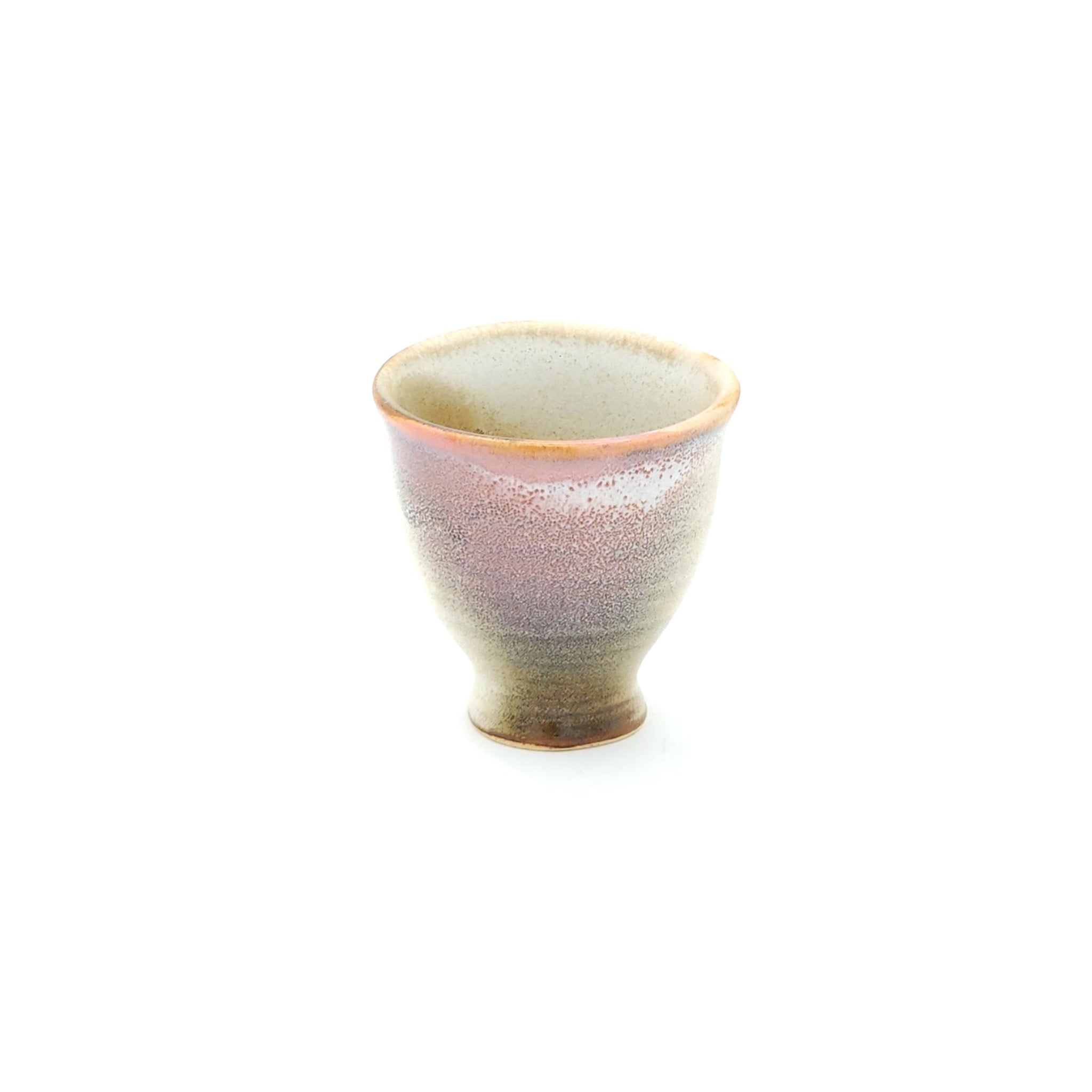A front view of a pink Japanese ceramic Conical Sake cup. Tsukushi