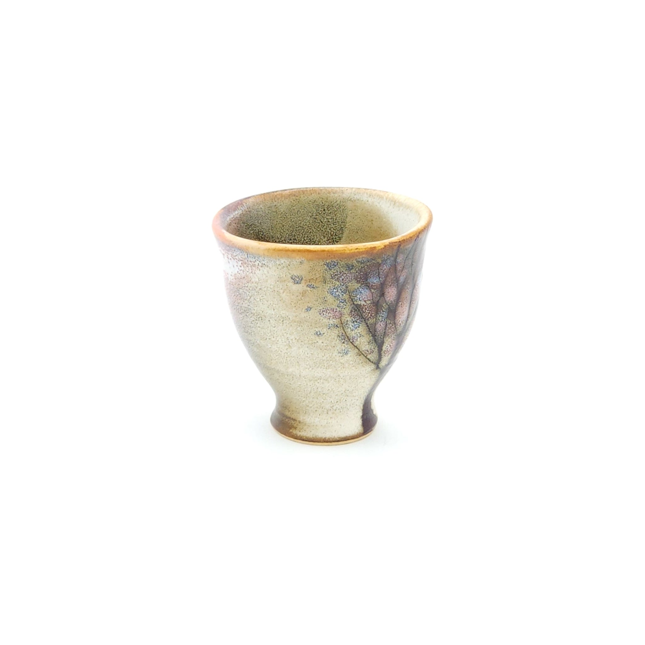 A Japanese ceramic Conical Sake cup with flower motifs. Tsukushi