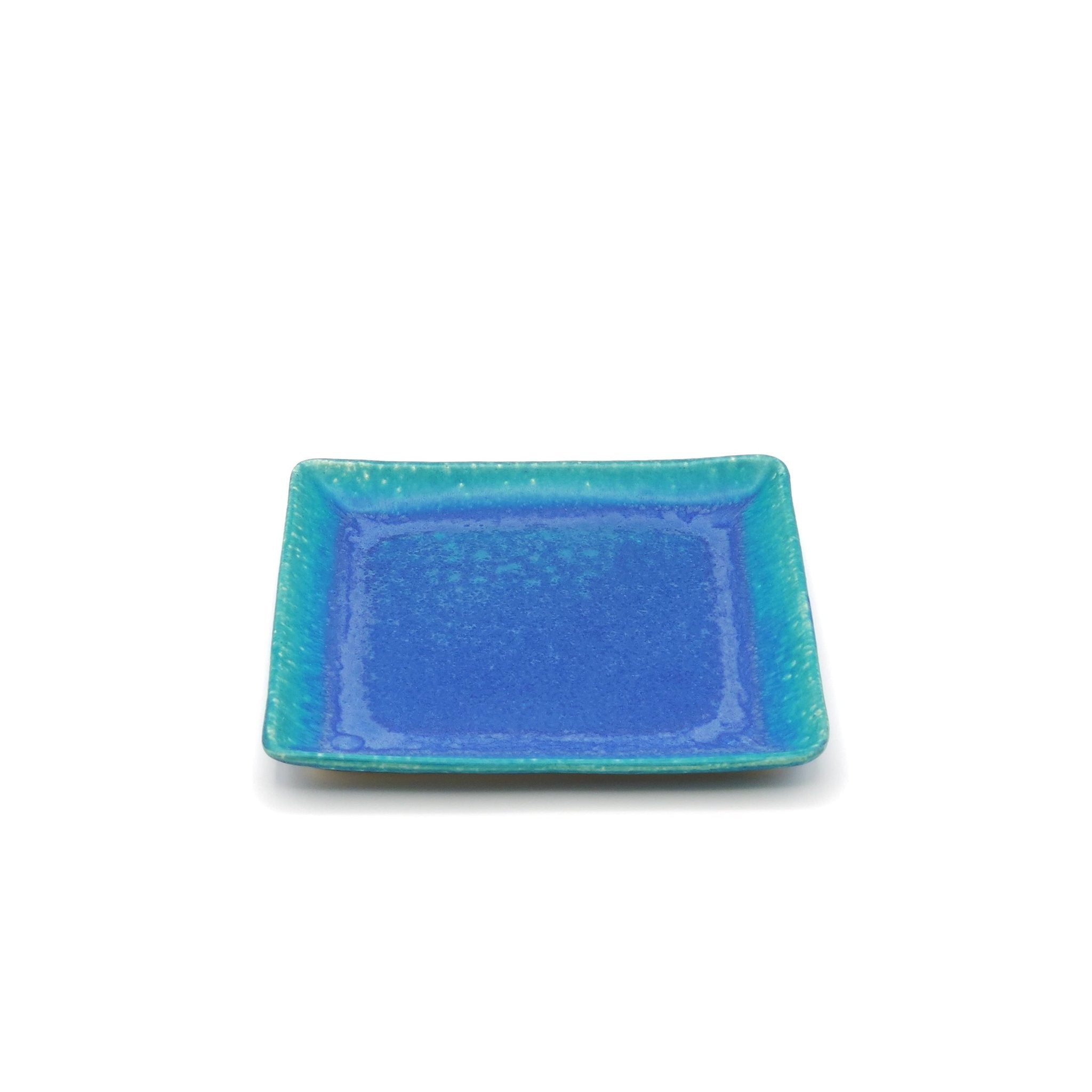 Top front view of a turquoise Japanese pottery plate measuring 21.5cm (8.5")