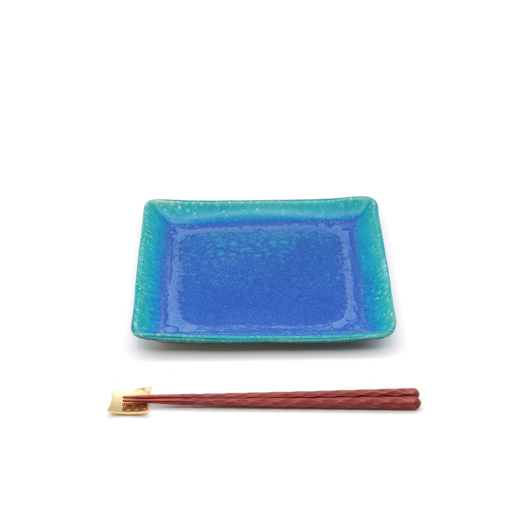 A turquoise Japanese pottery plate measuring 21.5cm (8.5") with chopsticks