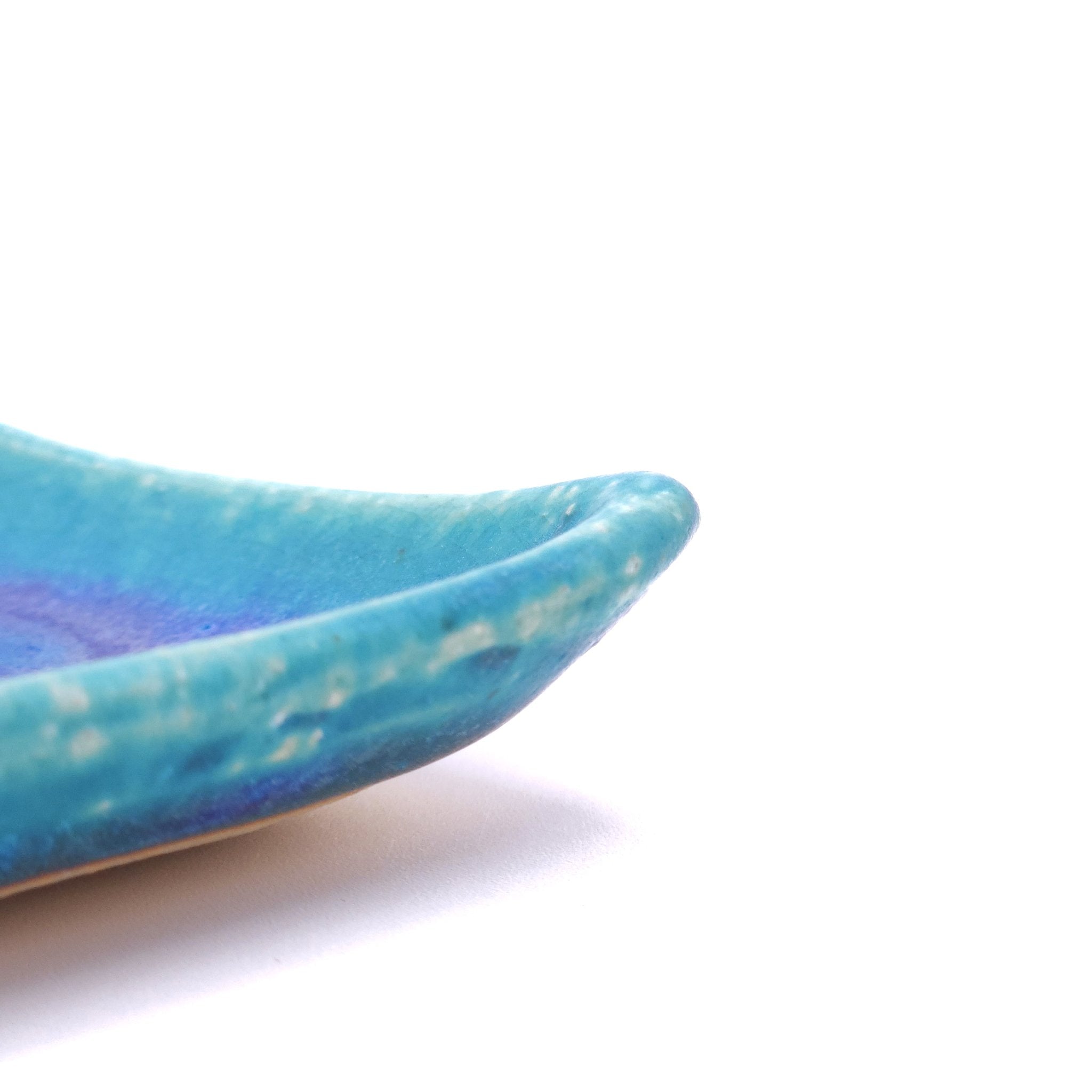 Angle detail fo a turquoise Japanese pottery plate measuring 7.5cm (7.9") 2