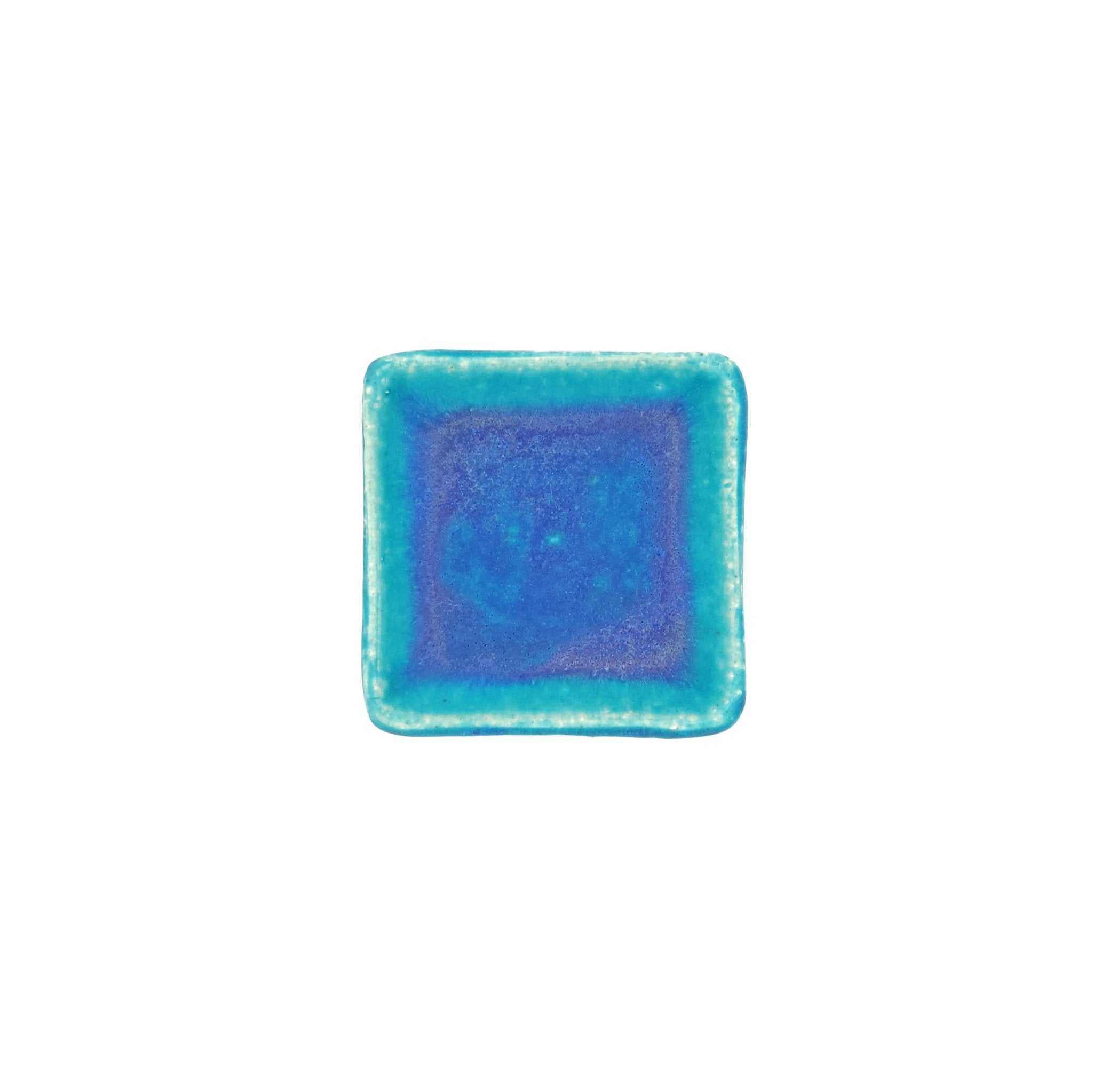 Top view of a turquoise Japanese pottery plate measuring 7.5cm (7.9")