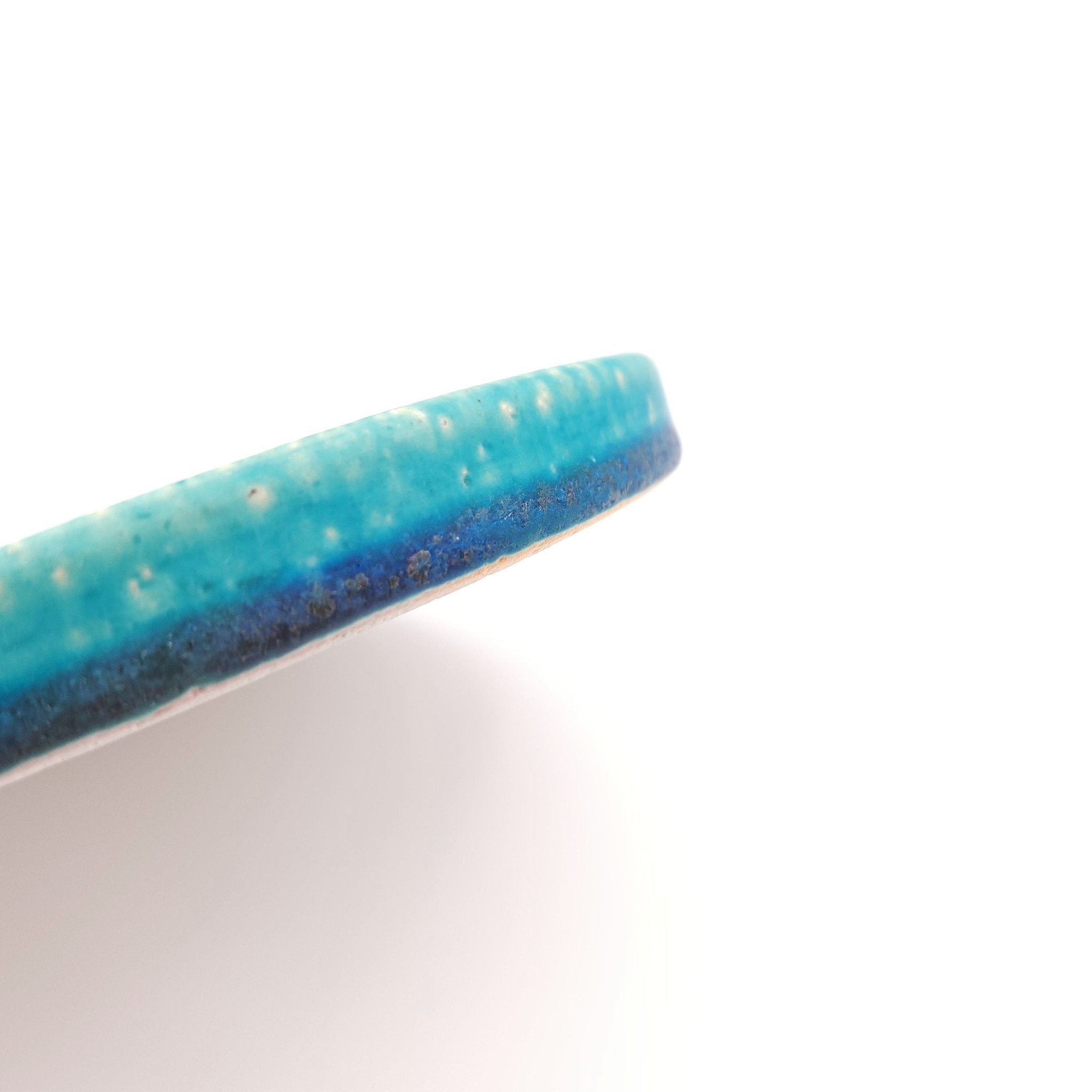 Side view detail of a turquoise Japanese pottery round Plate 16cm (9.4")