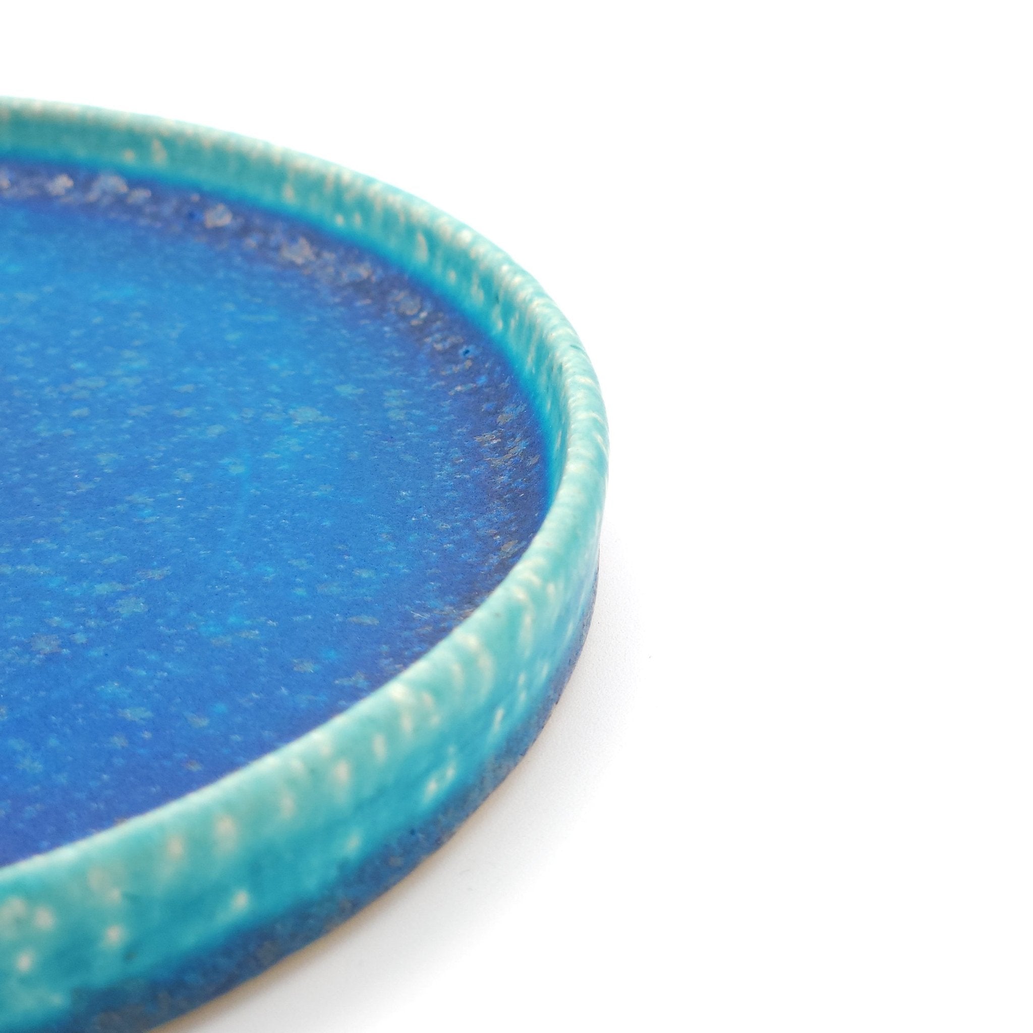 Edge detail of a turquoise Japanese pottery round Plate 16cm (9.4")