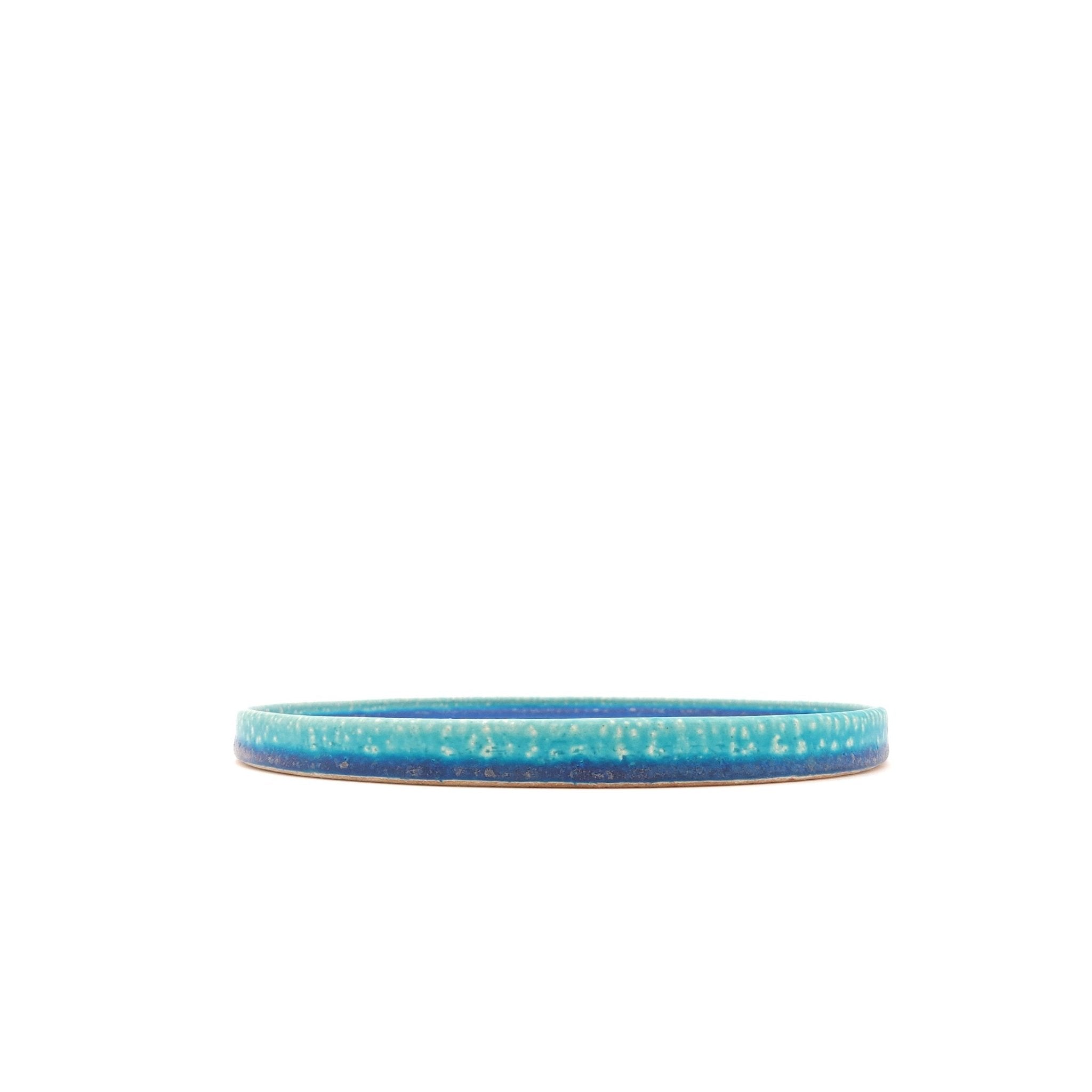 Side view of a turquoise Japanese pottery round Plate 21cm (8.3")