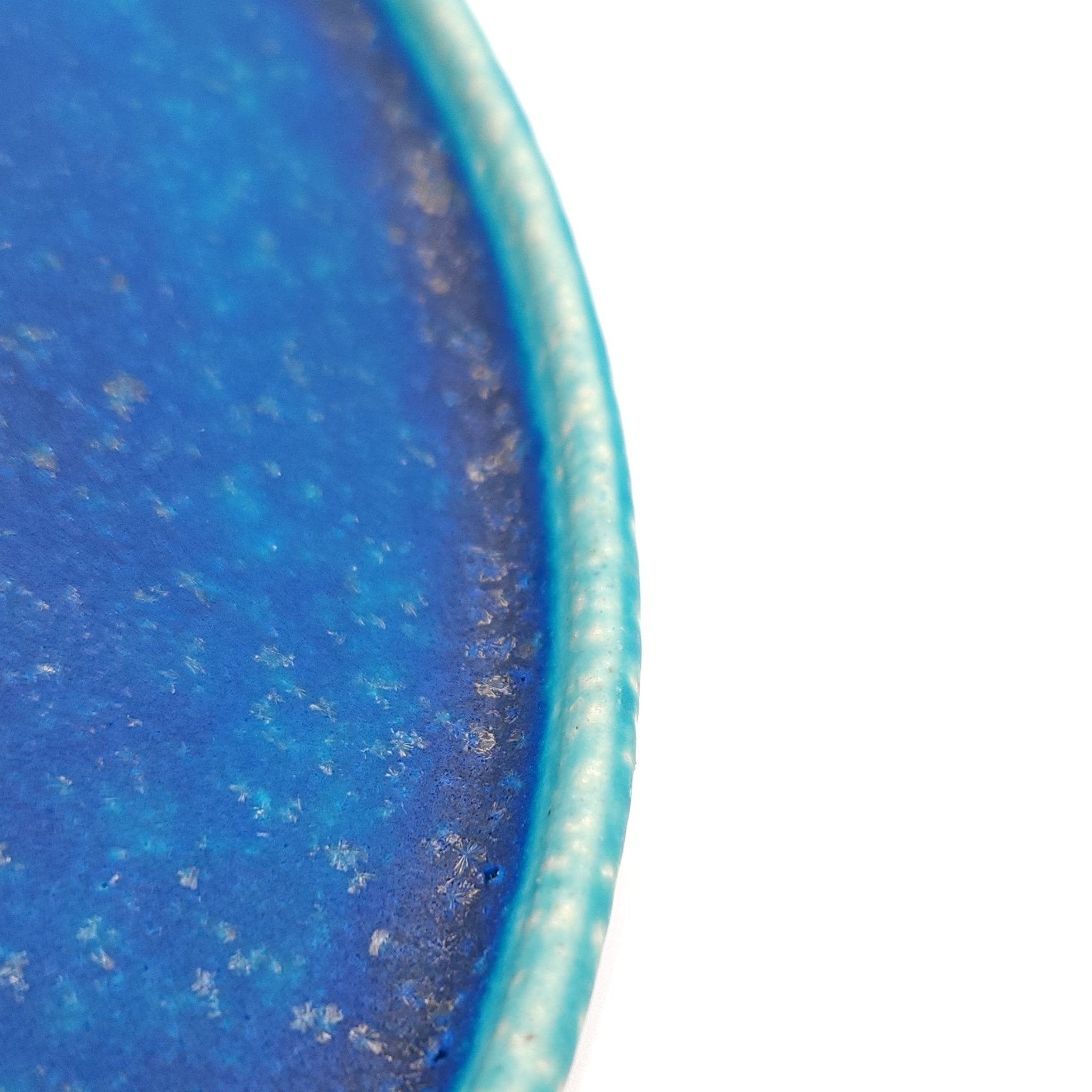 Side detail a turquoise Japanese pottery round Plate 21cm (8.3")