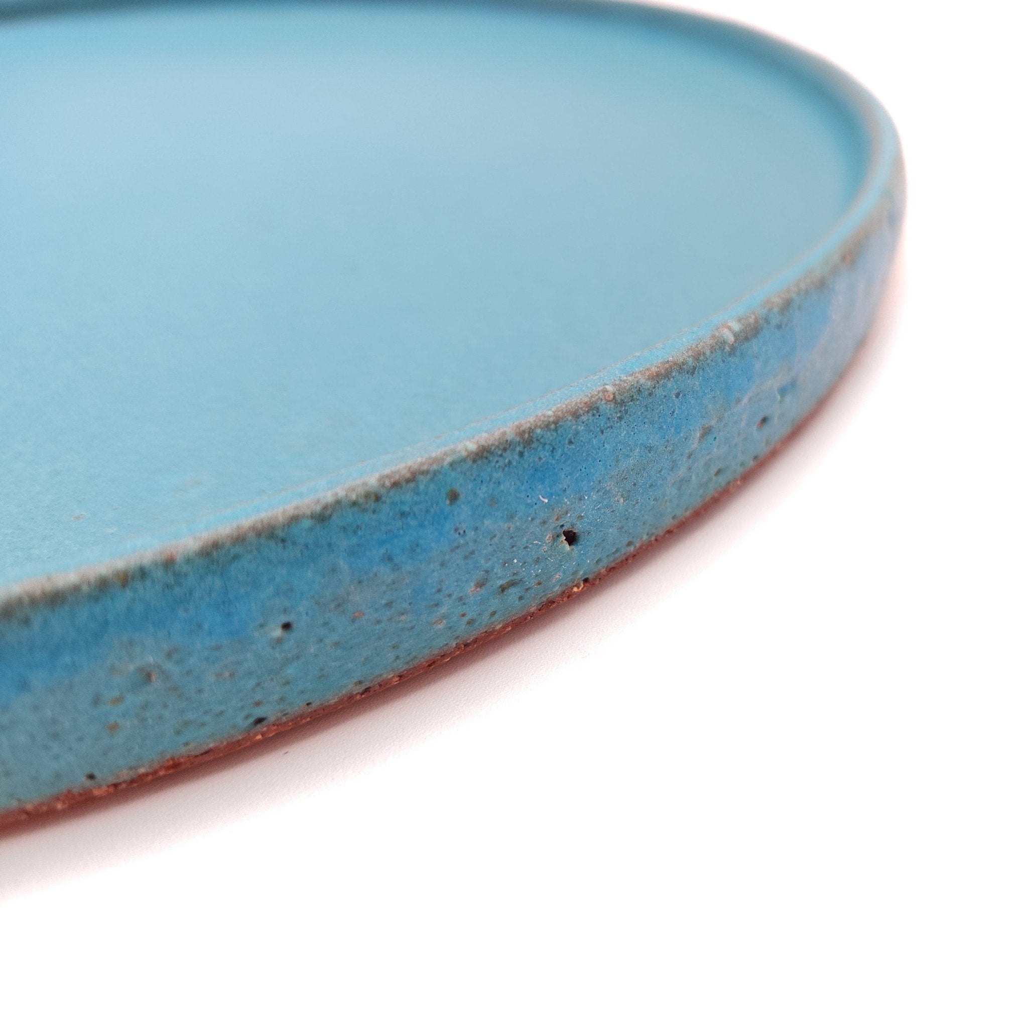 Side detail of a turquoise Japanese pottery round Plate 24cm (9.4")