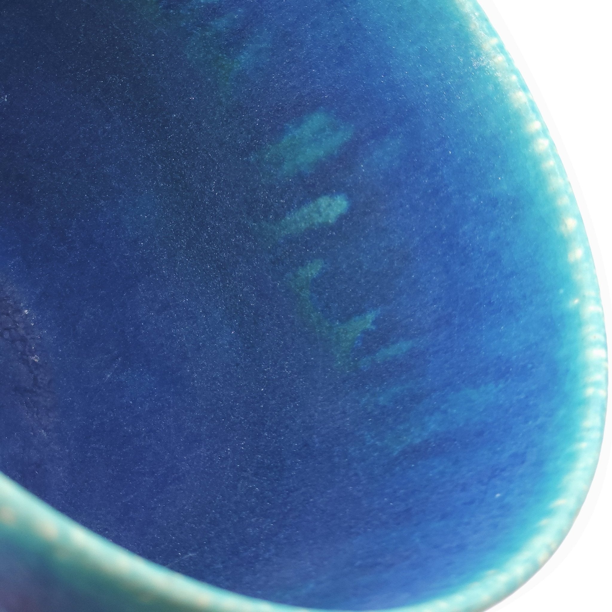 Inside detail of a turquoise Japanese pottery salad bowl