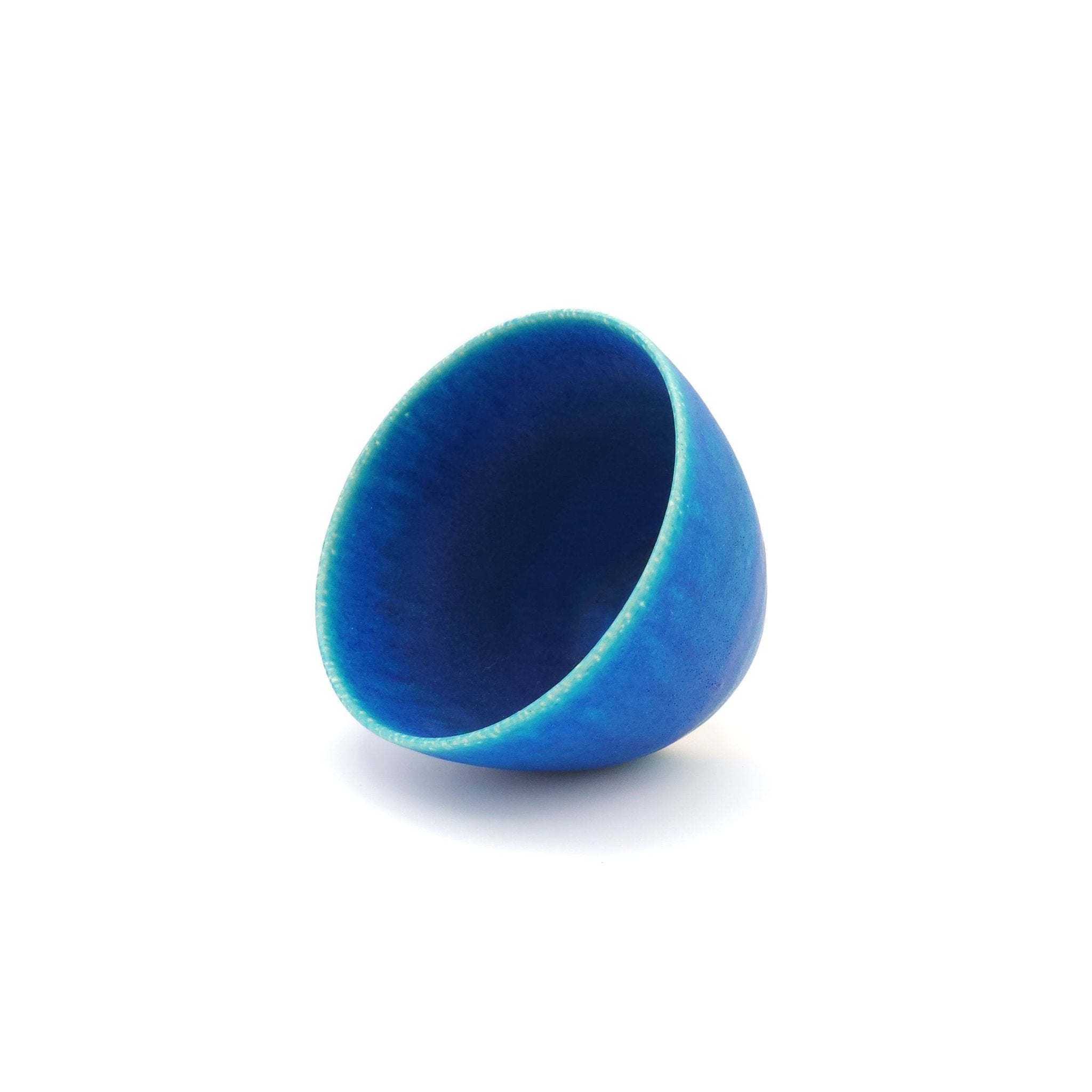 Oblique view of a turquoise Japanese pottery salad bowl