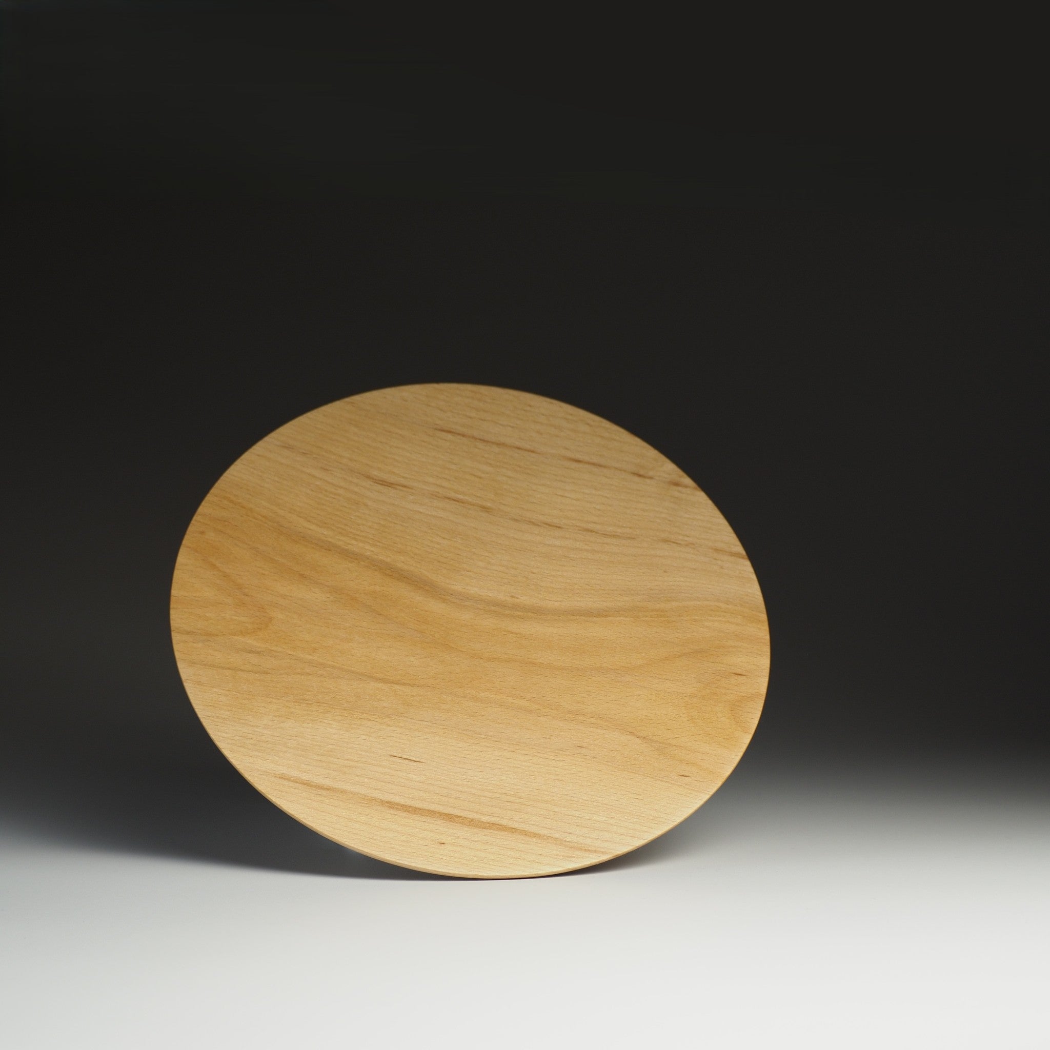 Japanese wooden plate on shaded background, Tsukushi.