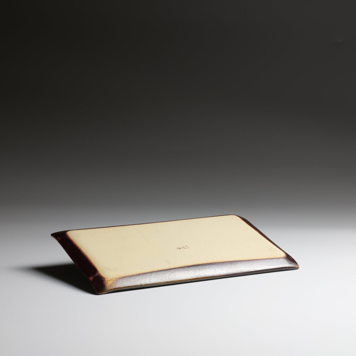Bottom view of Akafuji handmade rectangular plate showing the ceramic base