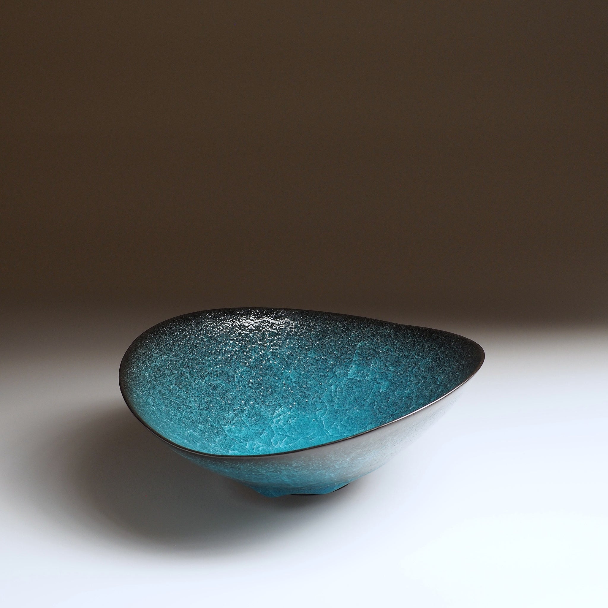 Aonami waved serving bowl, interior view showing teal kannyu craquelé glaze texture. Taichi Kawai, Usurai Pottery, Japan.