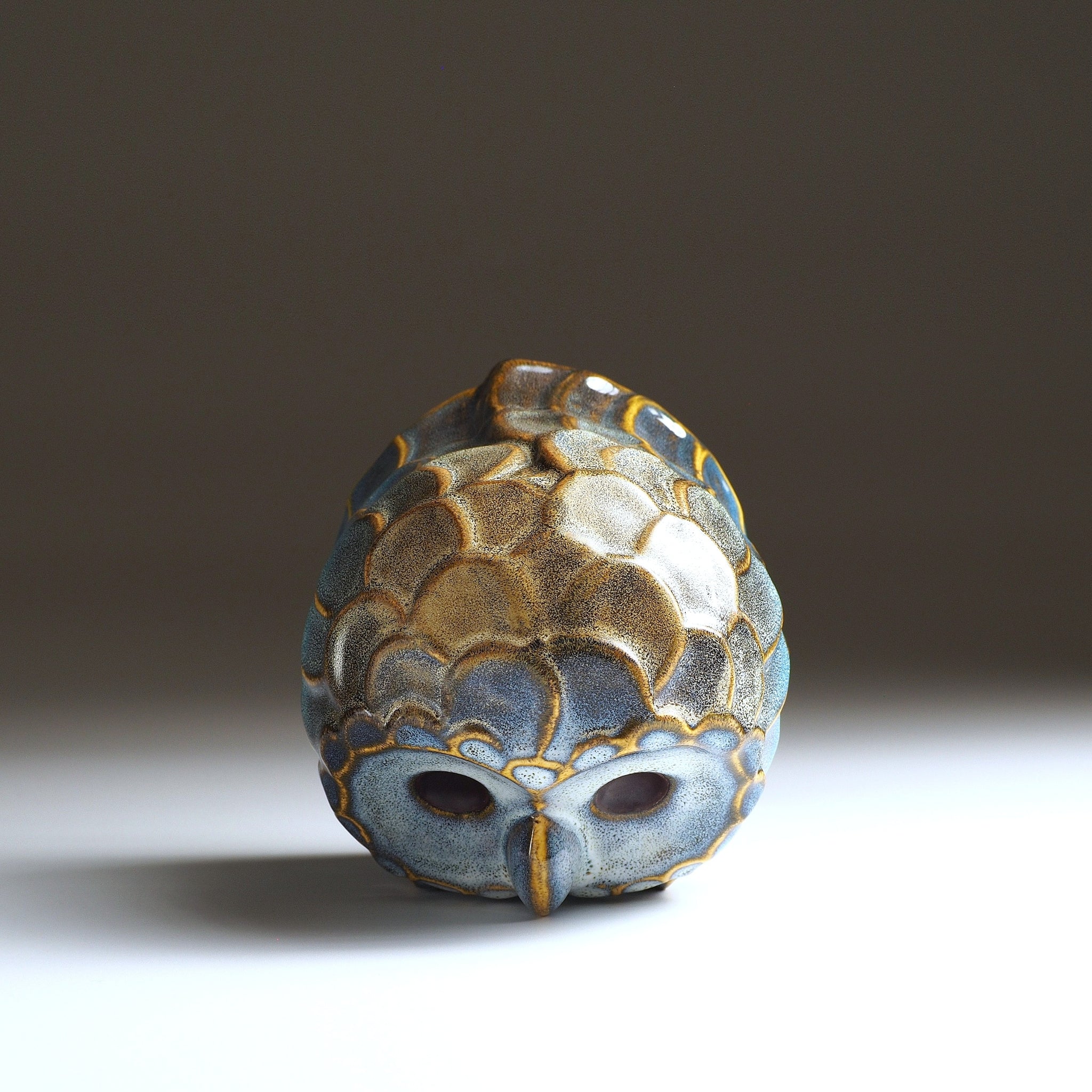 Top view of the medium Fukumori ceramic owl ornament showing the glazed head and feather detailing