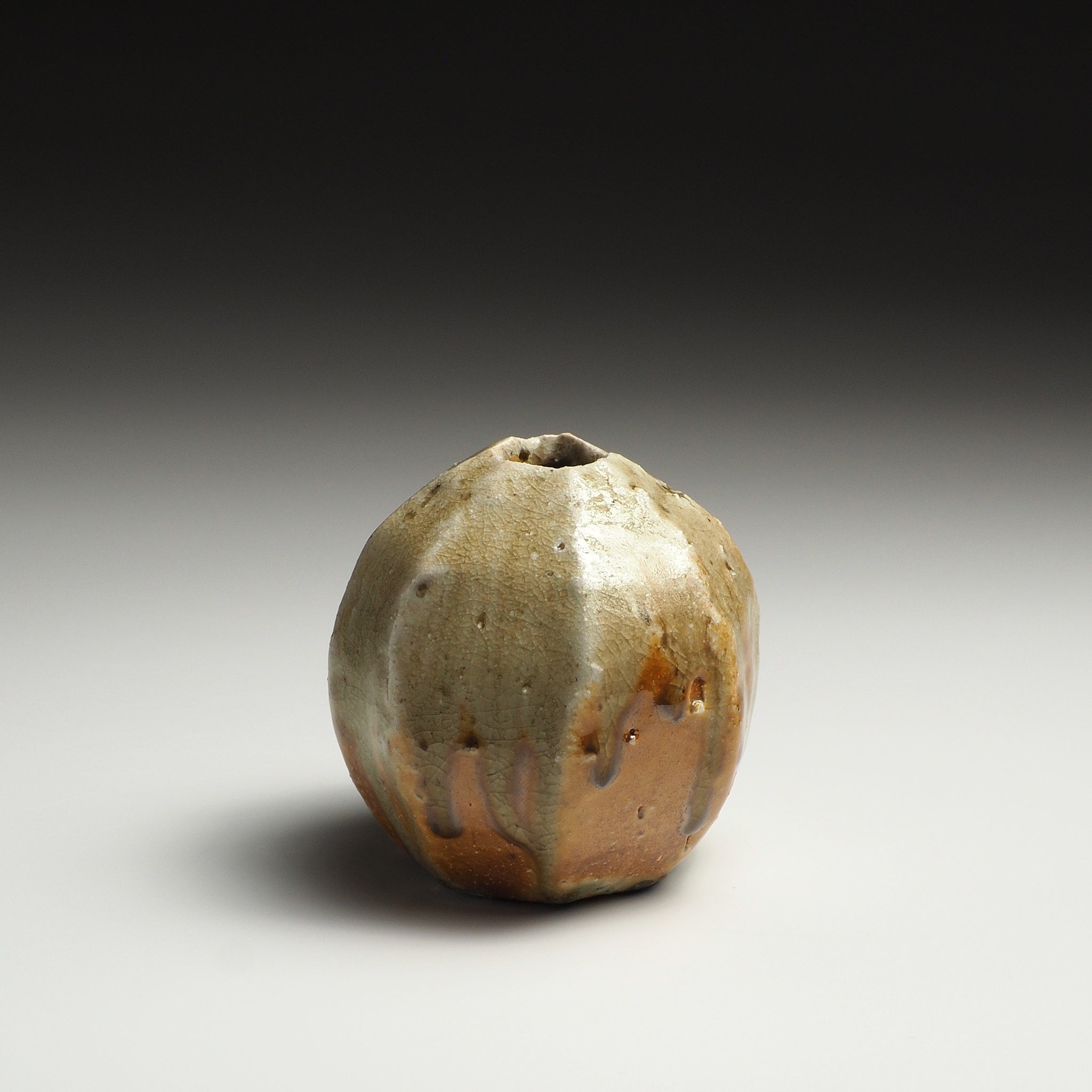 Front view of the Kokeishi handmade Shigaraki flower vase showing its rounded body and small opening.