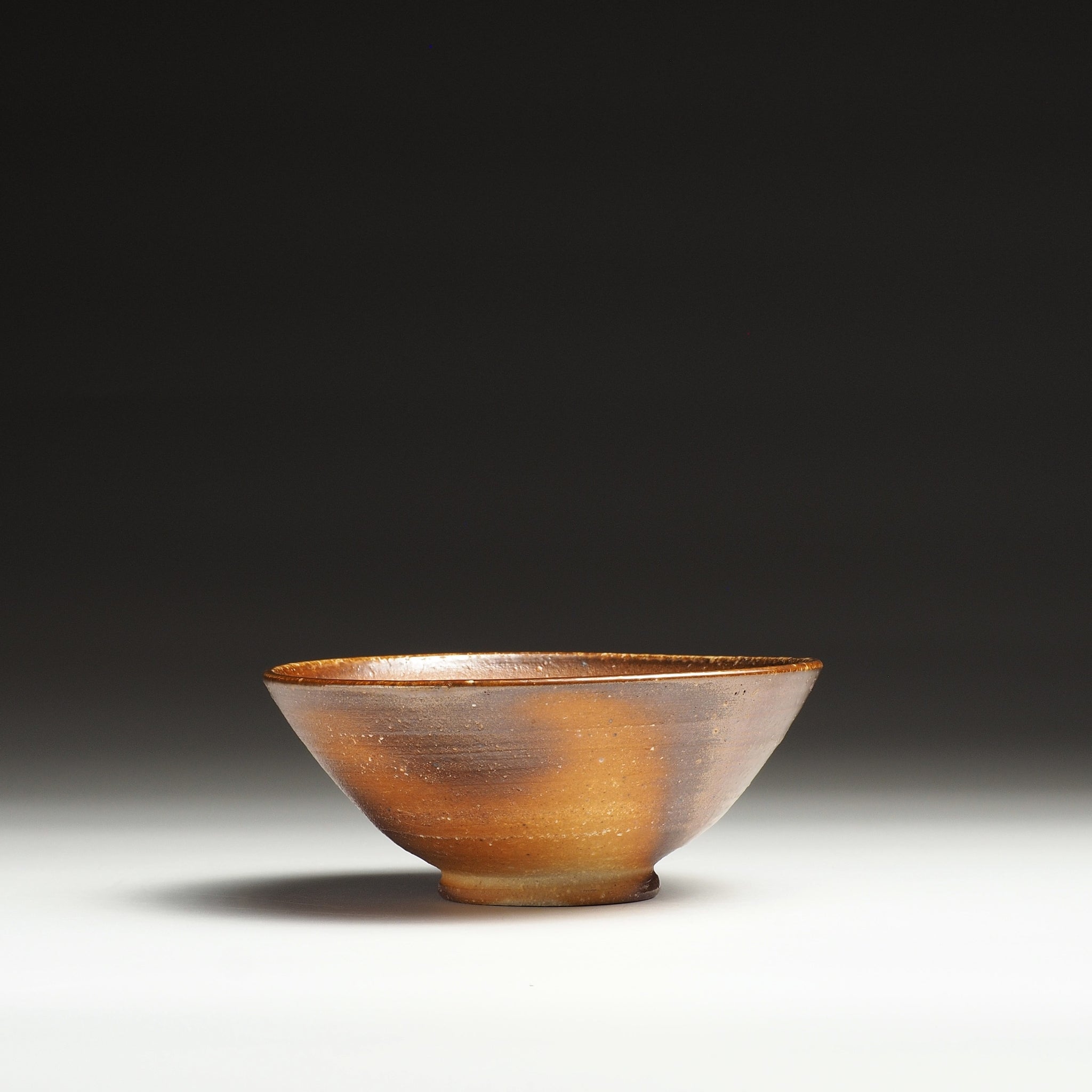 Single Mizuho handmade Shigaraki rice bowl with a gently flared form and warm brown surface.