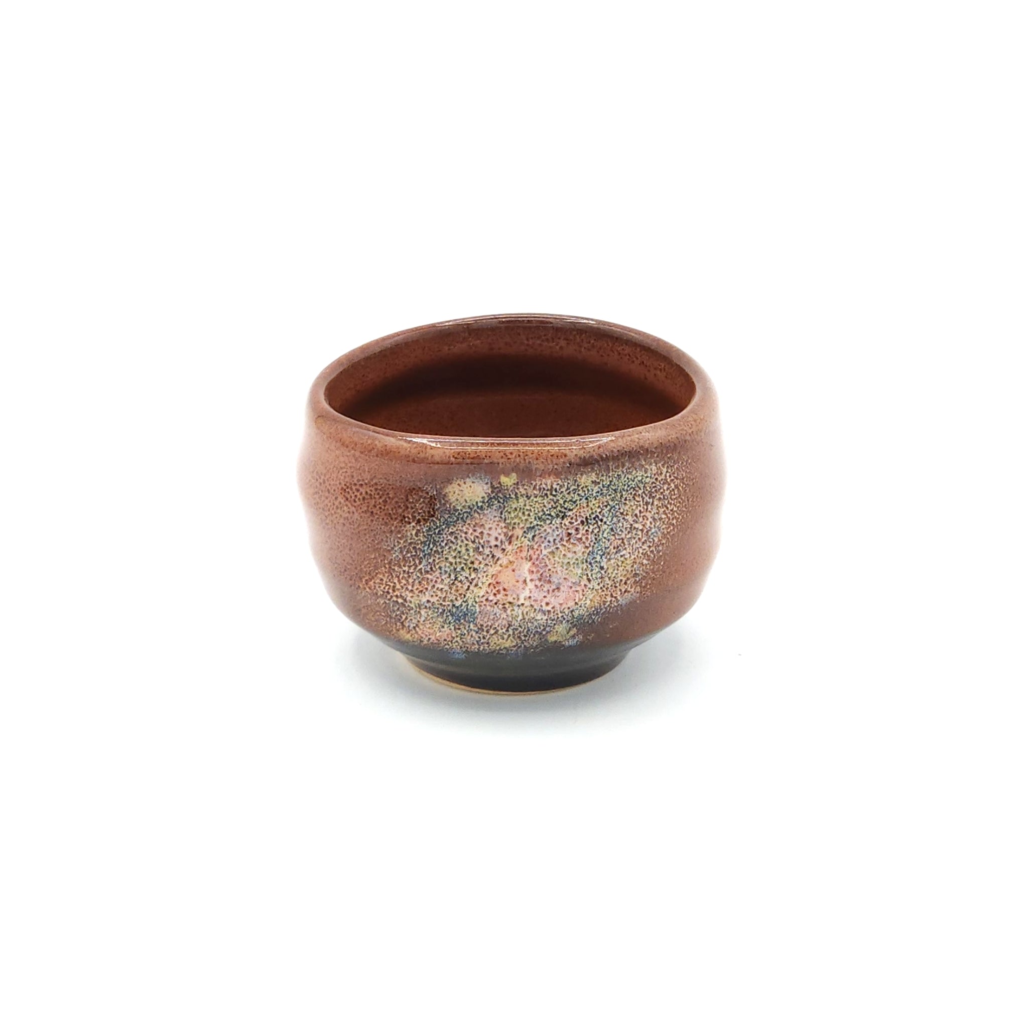 A brown Japanese ceramic round sake cup. Tsukushi