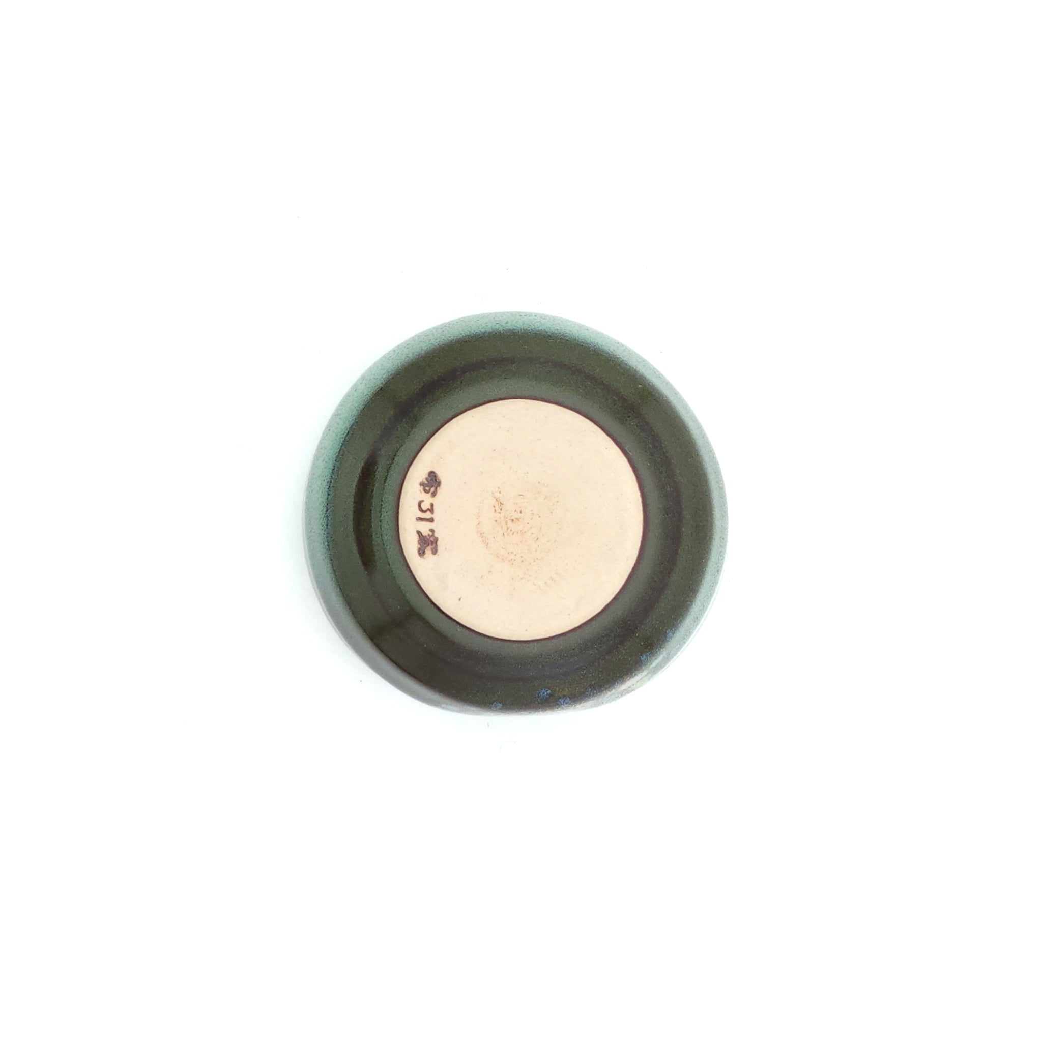 A bottom view of a Green Japanese round sake cup. Tsukushi