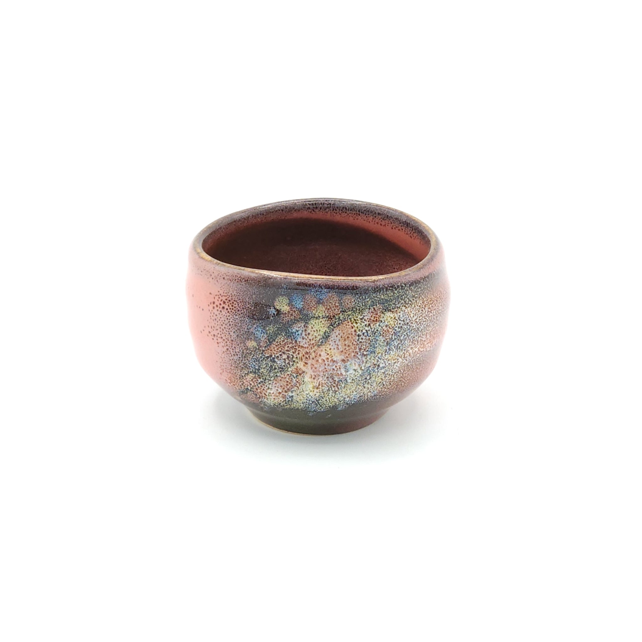 A pink Japanese round sake cup. Tsukushi