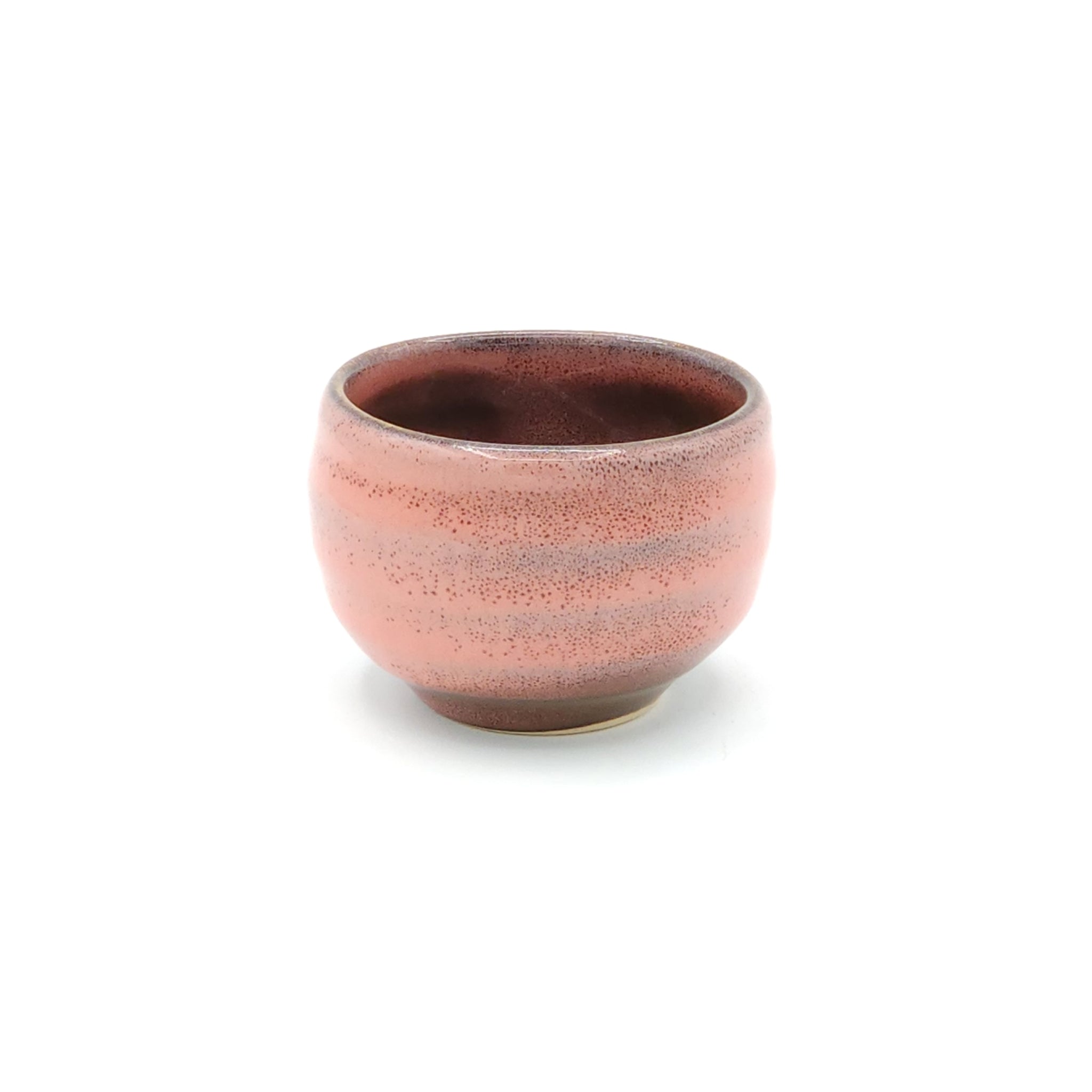 A Japanese round pink sake cup. Tsukushi
