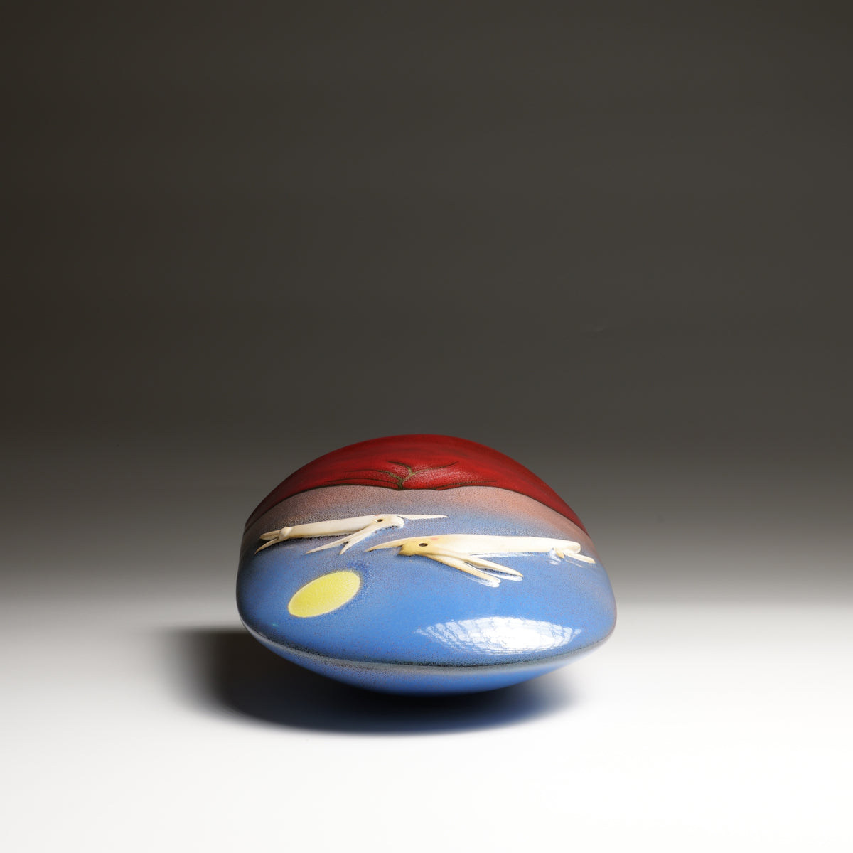 Tsukimi ceramic ornament by Kazuhiro Kojima, top view with red glaze, blue sky and yellow moon detail.