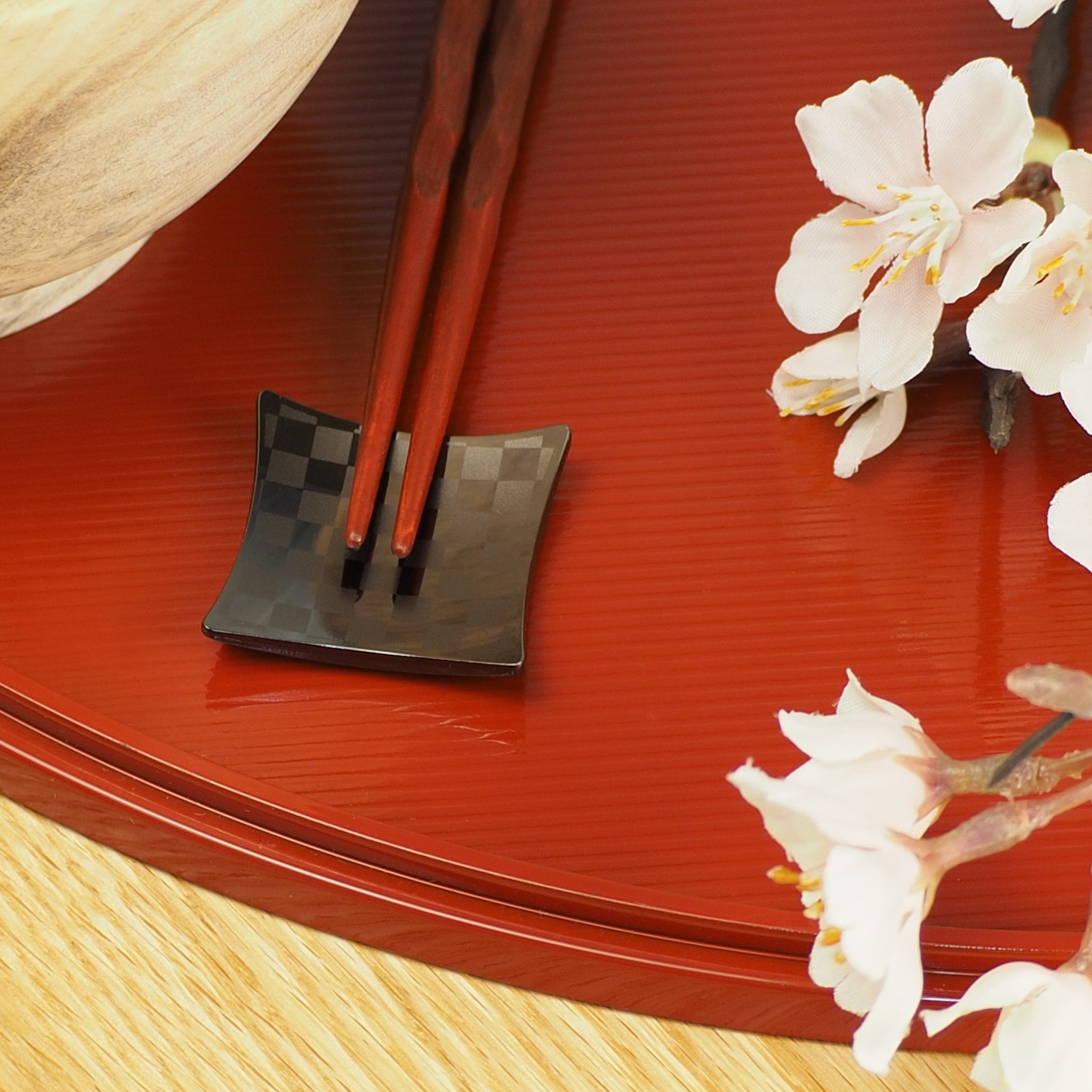 Black Hashioki on red tray