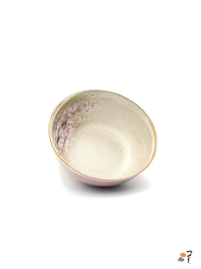 Authentic Japanese pottery salad bowl with cherry blossoms decoration. Pink and beige color. (front-side view).