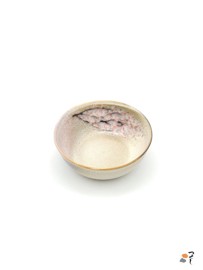 Authentic Japanese pottery salad bowl with cherry blossoms decoration. Pink and beige color. (side view 1).