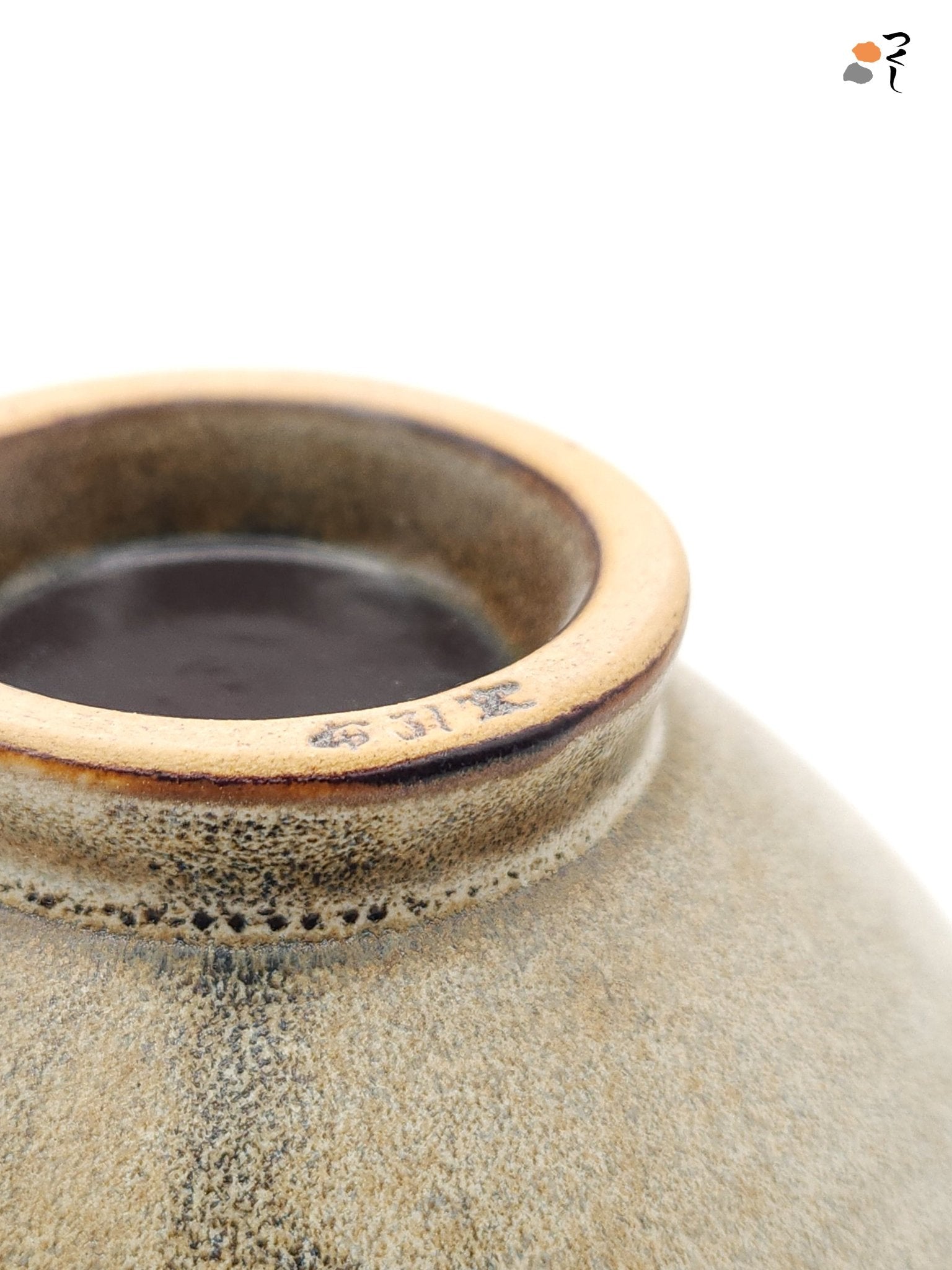 Authentic Japanese pottery bowl with cherry blossoms decoration. Green and beige color. (bottom detail 1)