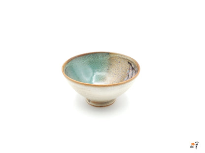 Authentic Japanese pottery bowl with cherry blossoms decoration. Green and beige color. (side view 8).