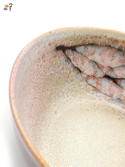 Authentic Japanese pottery salad bowl with cherry blossoms decoration. Pink and beige color. (detail view 2).