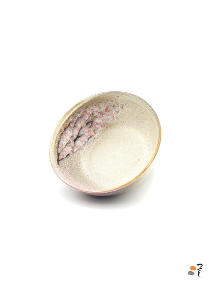 Authentic Japanese pottery salad bowl with cherry blossoms decoration. Pink and beige color. (front side view 1).