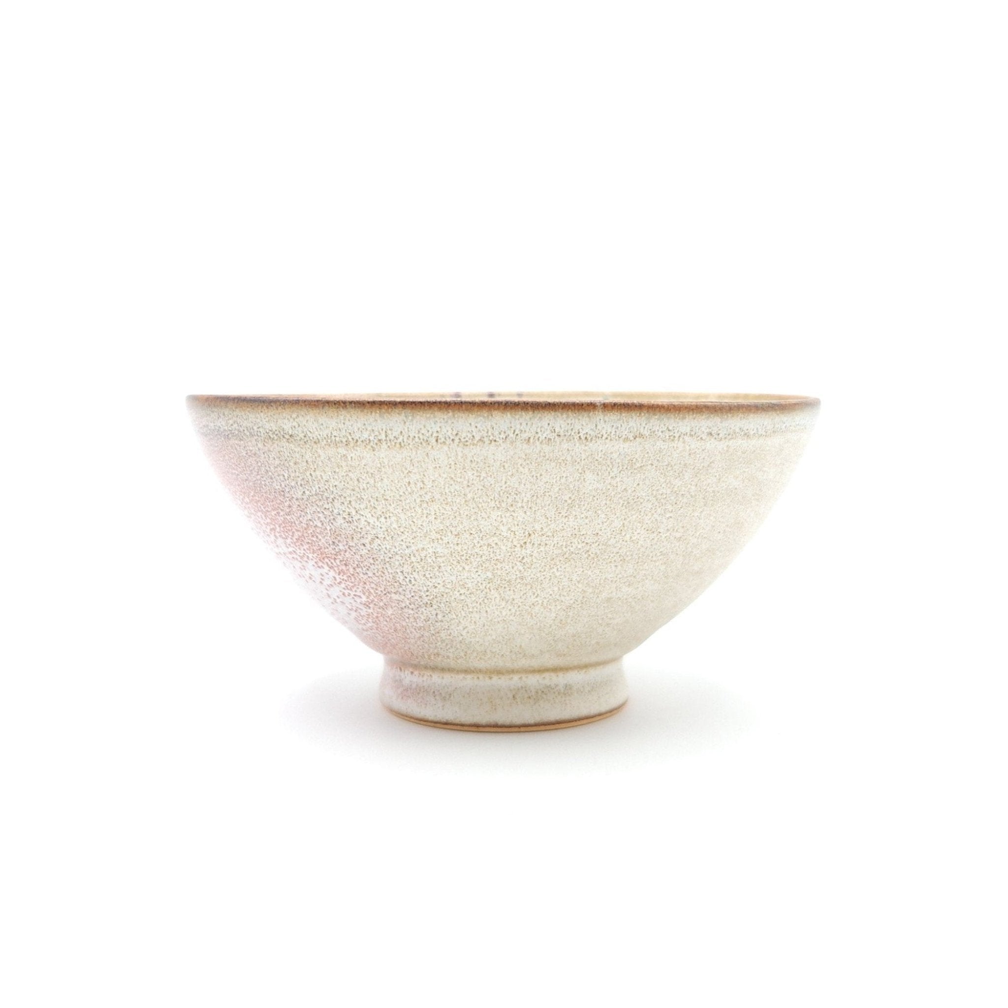 Authentic Japanese pottery bowl with cherry blossoms decoration. Pink and beige color. (side view 3).