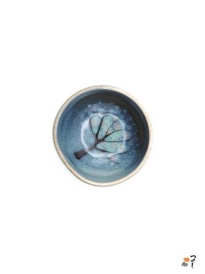 Authentic Japanese pottery teacup with tree decoration. blue and white color.  (top view 1).