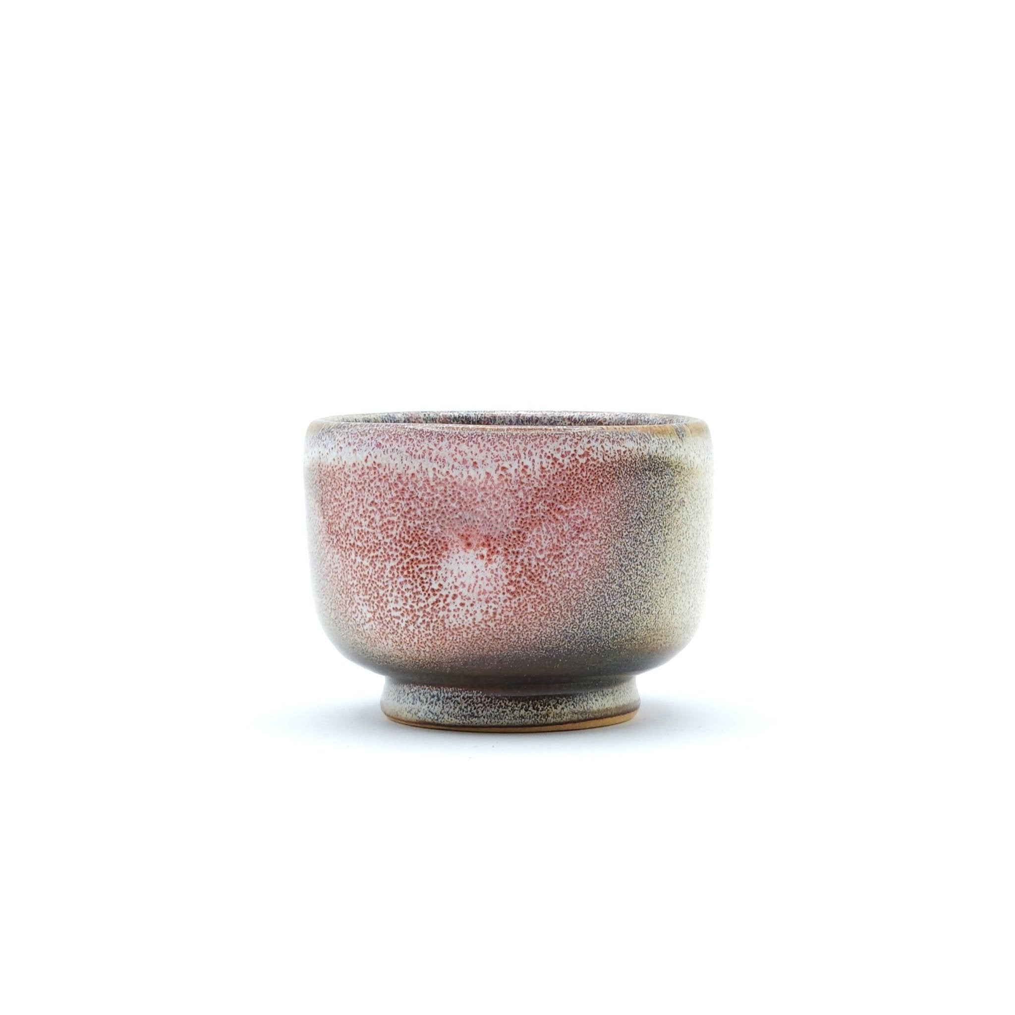 Authentic Japanese pottery teacup with cherry blossoms decoration. pick and beige color. (side view 2).