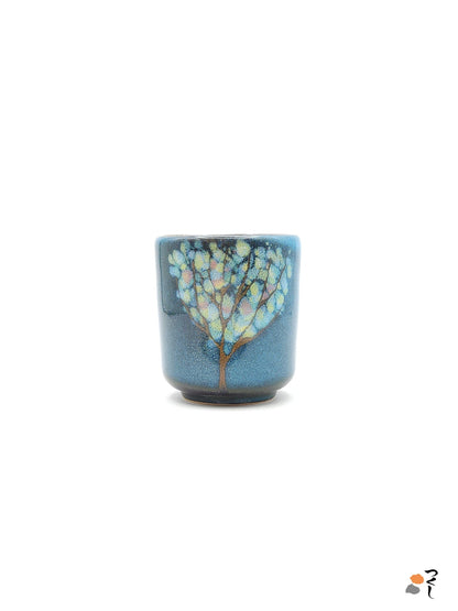 Authentic Japanese pottery teacup tall with tree pattern decoration. blue color. (side view 3).