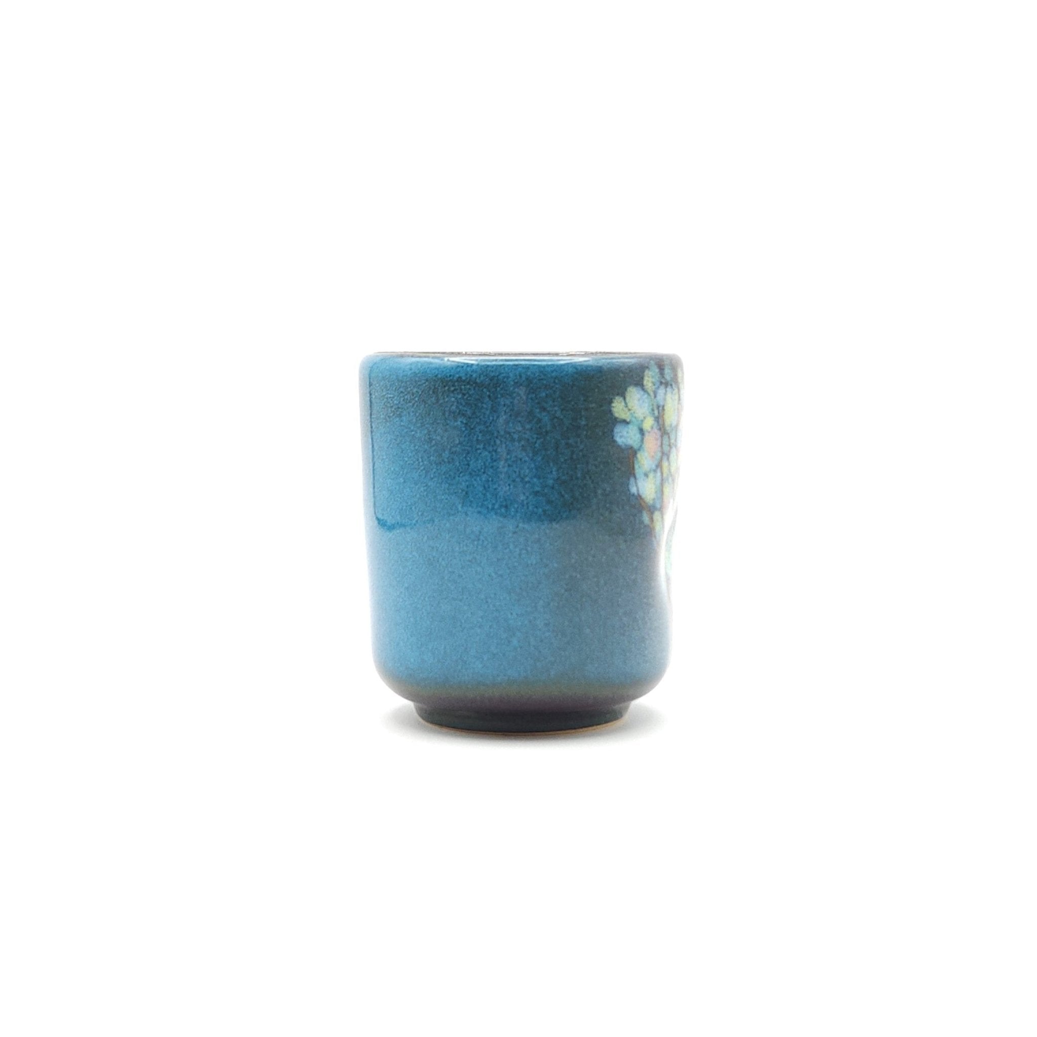 Authentic Japanese pottery teacup tall with tree pattern decoration. blue color. (side view 5).