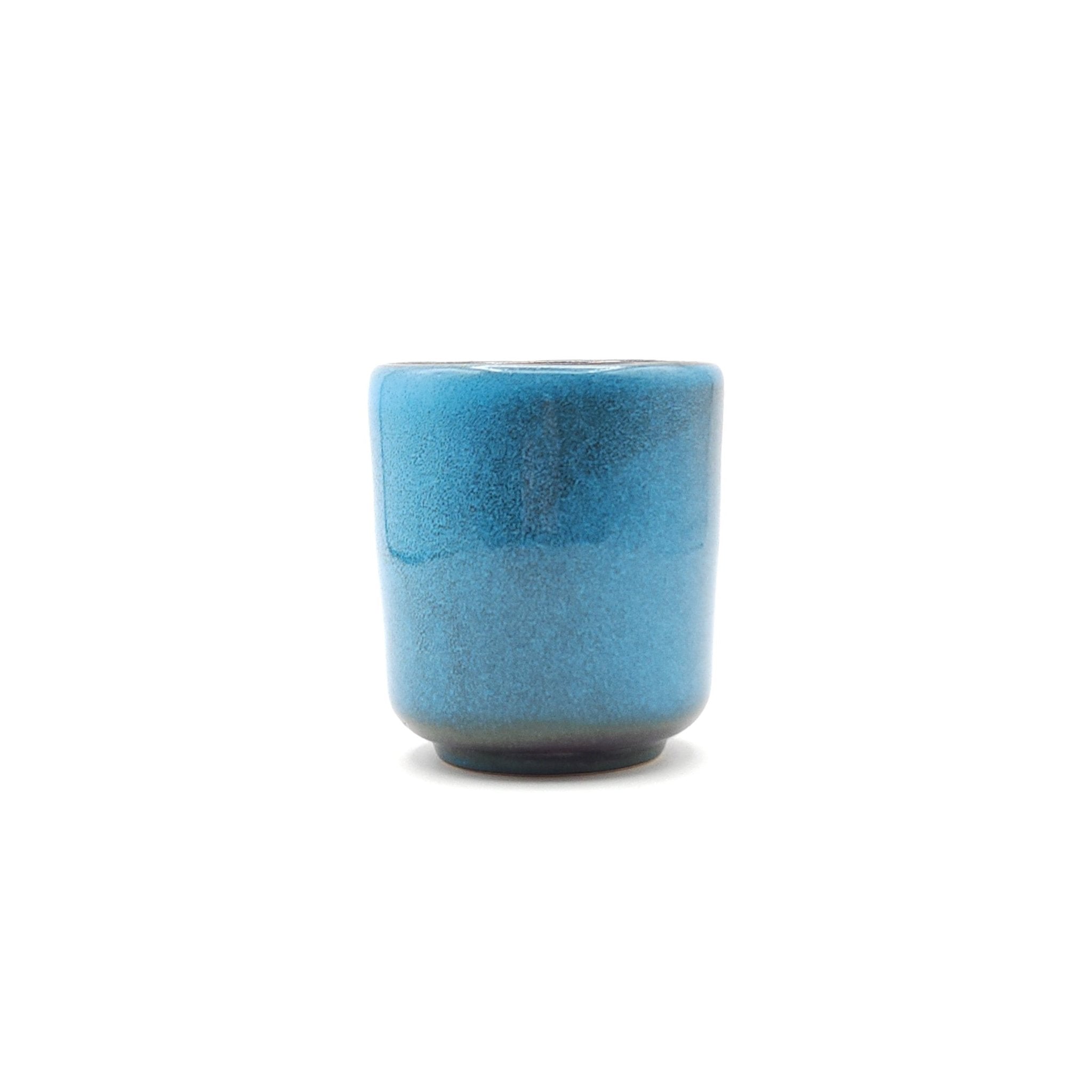 Authentic Japanese pottery teacup tall with tree pattern decoration. blue color. (side view 6).