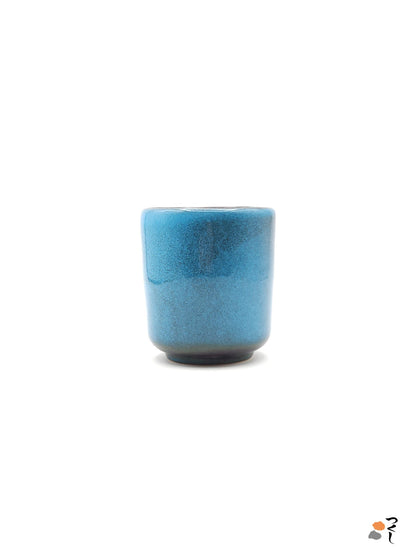 Authentic Japanese pottery teacup tall with tree pattern decoration. blue color. (side view 6).