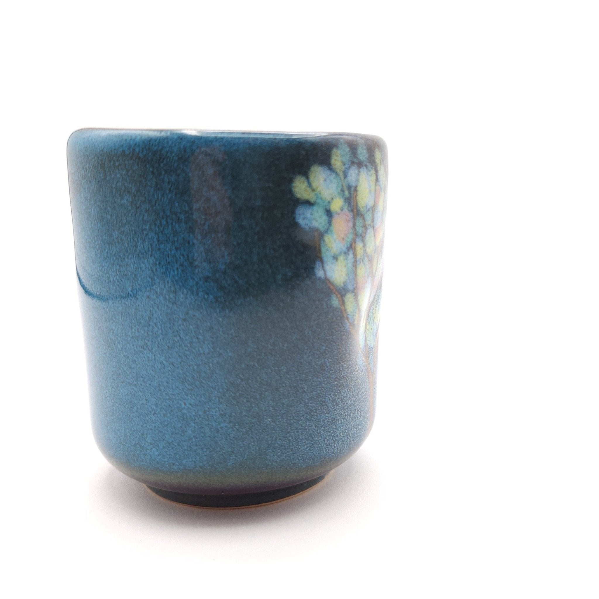 Authentic Japanese pottery teacup tall with tree pattern decoration. blue color.  (side detail view 2).