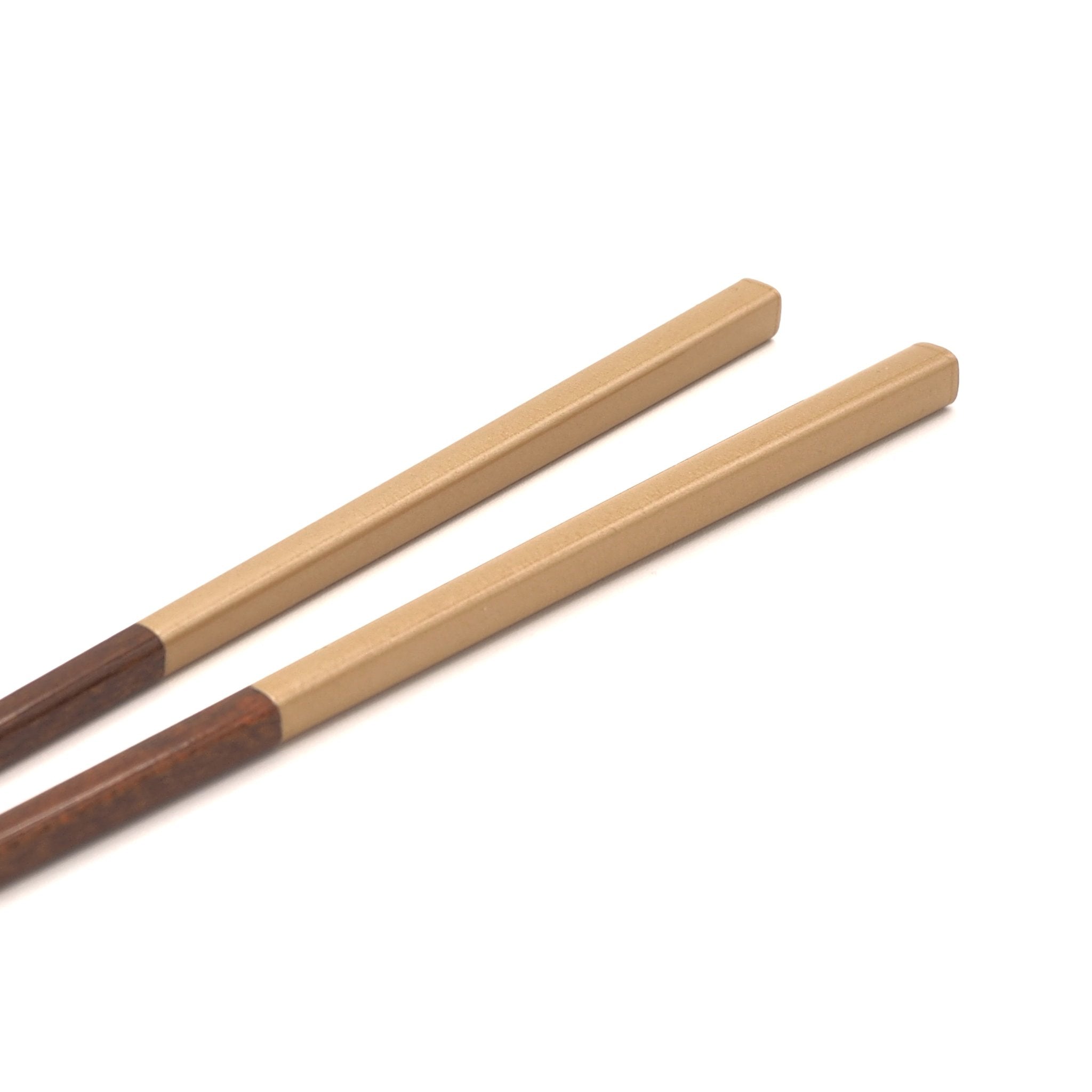 Golden Japanese wooden chopsticks , detail view 