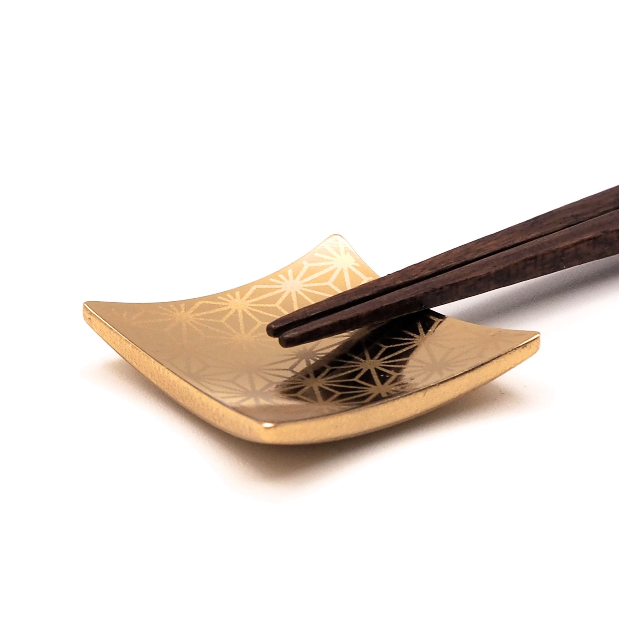 Point detail on rest of Japanese chopsticks with cherry blossom motifs